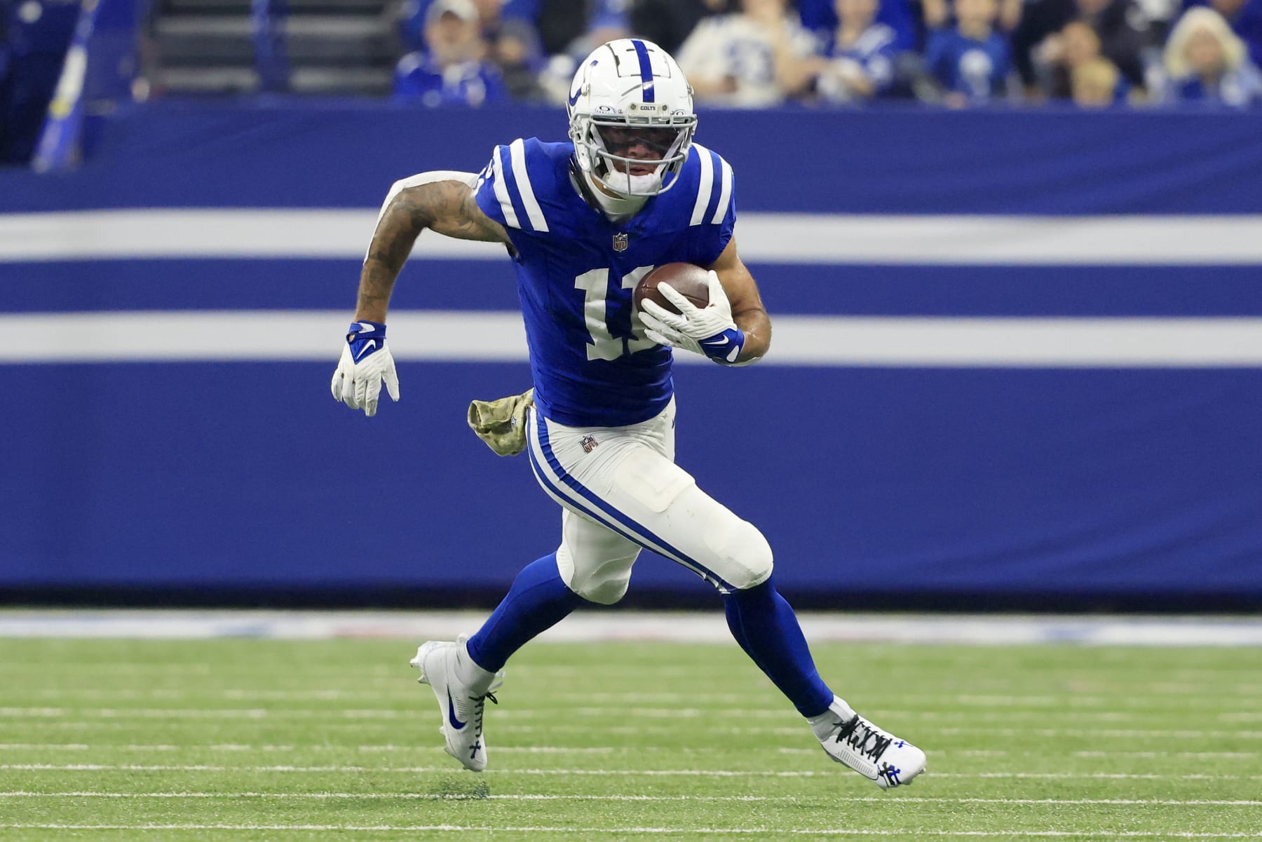 INDIANAPOLIS, INDIANA - NOVEMBER 26: Michael Pittman Jr. #11 of the Indianapolis Colts runs the ball after a catch in the game against the Tampa Bay Buccaneers at Lucas Oil Stadium on November 26, 2023 in Indianapolis, Indiana. (Photo by Justin Casterline/Getty Images)