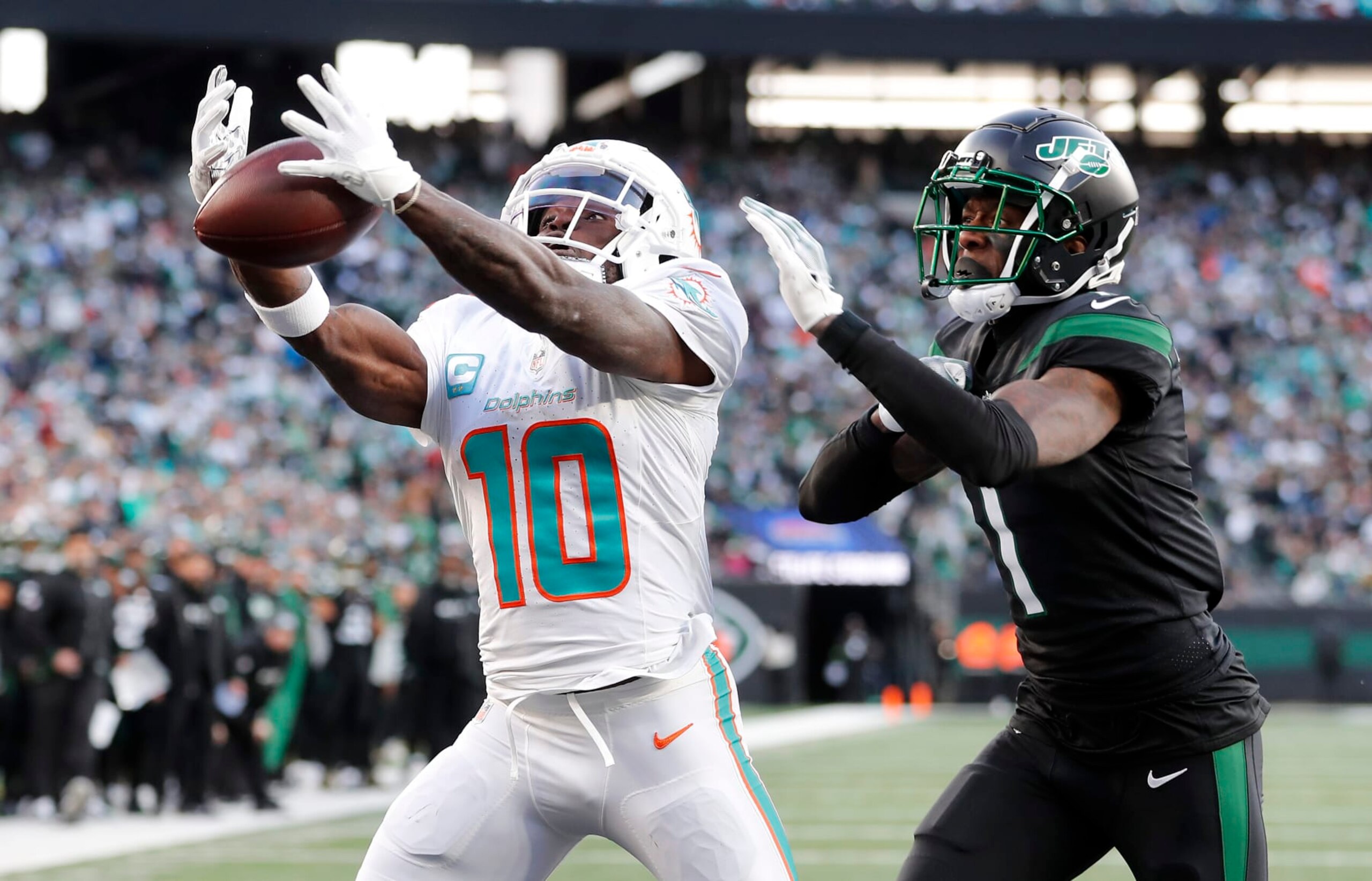 EAST RUTHERFORD, NEW JERSEY - NOVEMBER 24: (NEW YORK DAILIES OUT)  Tyreek Hill #10 of the Miami Dolphins in action against Sauce Gardner #1 of the New York Jets at MetLife Stadium on November 24, 2023 in East Rutherford, New Jersey. The Dolphins defeated the Jets 34-13.  (Photo by Jim McIsaac/Getty Images)