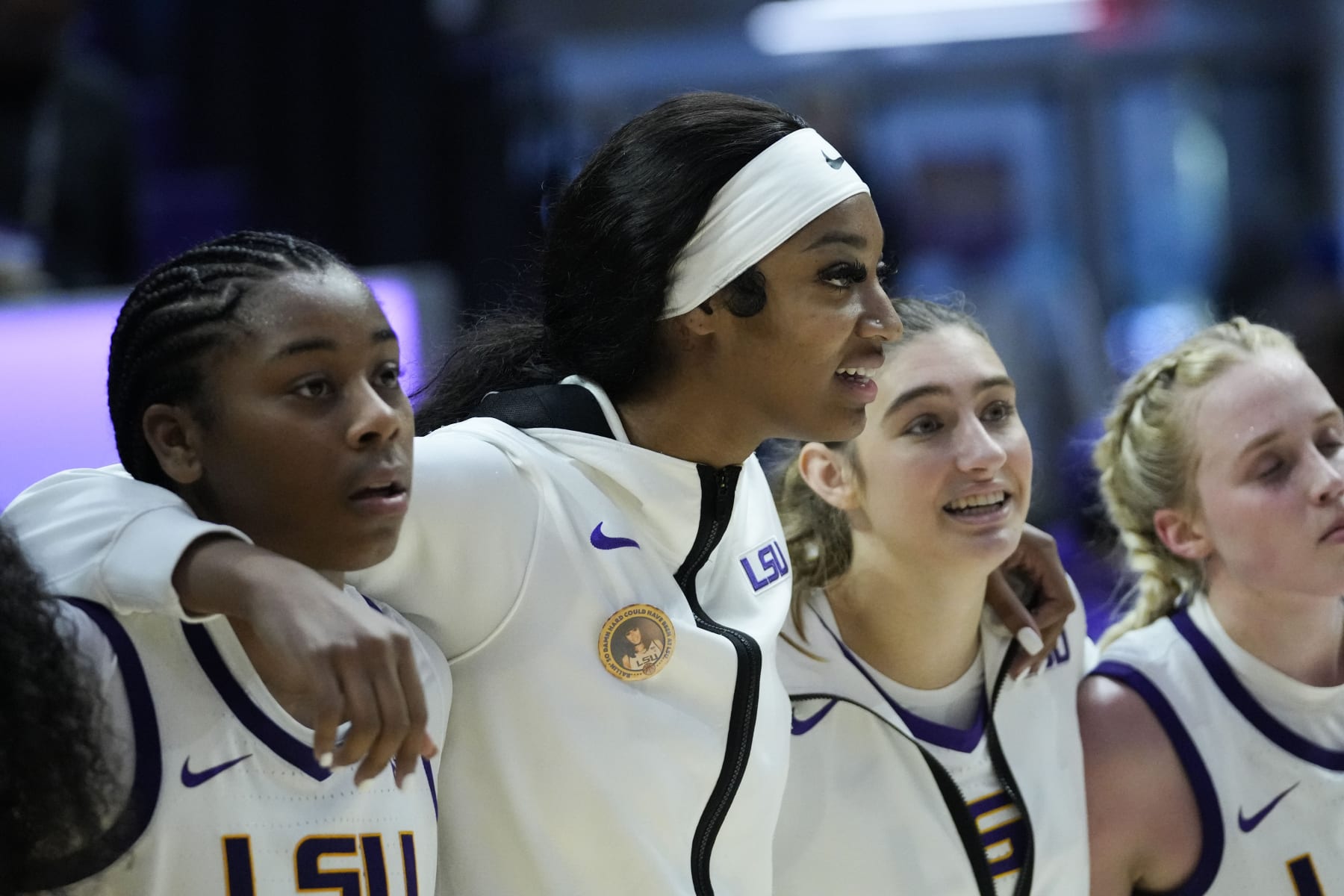 LSU forward Angel Reese center, sings the school alma mater with teammates in the second half an NCAA college basketball game in Baton Rouge, La., Tuesday, Nov. 14, 2023. LSU won 109-79. (AP Photo/Gerald Herbert)