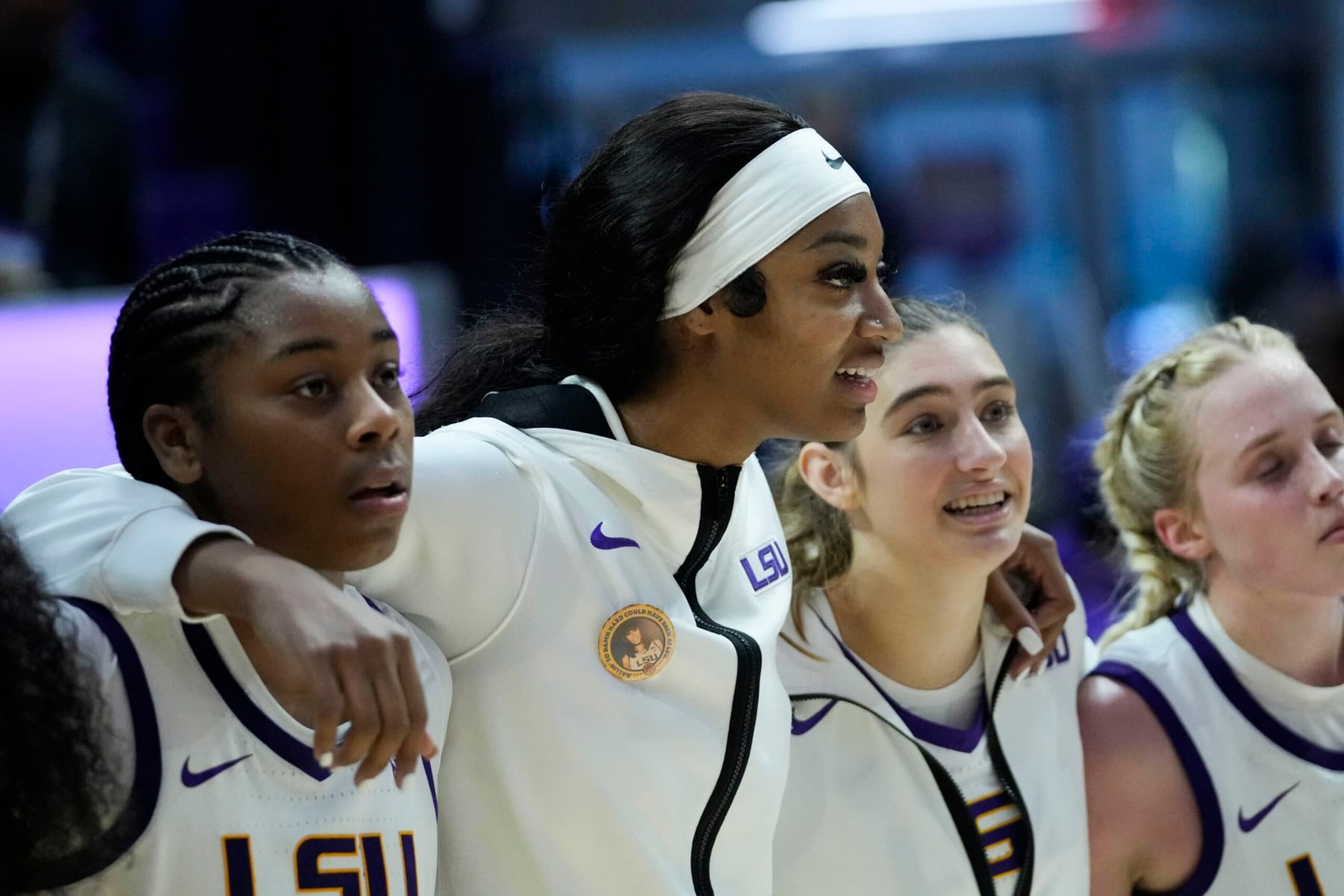 LSU forward Angel Reese center, sings the school alma mater with teammates in the second half an NCAA college basketball game in Baton Rouge, La., Tuesday, Nov. 14, 2023. LSU won 109-79. (AP Photo/Gerald Herbert)