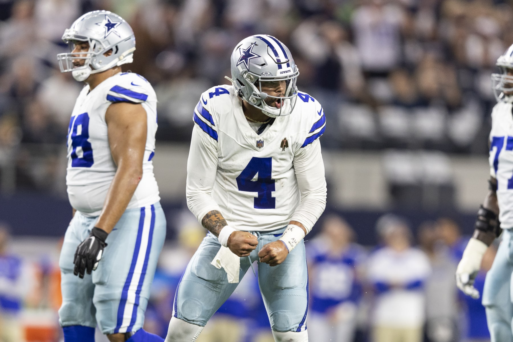 ARLINGTON, TEXAS - NOVEMBER 30: Dak Prescott #4 of the Dallas Cowboys celebrates after a touchdown during an NFL football game between the Dallas Cowboys and the Seattle Seahawks at AT&T Stadium on November 30, 2023 in Arlington, Texas. (Photo by Michael Owens/Getty Images)