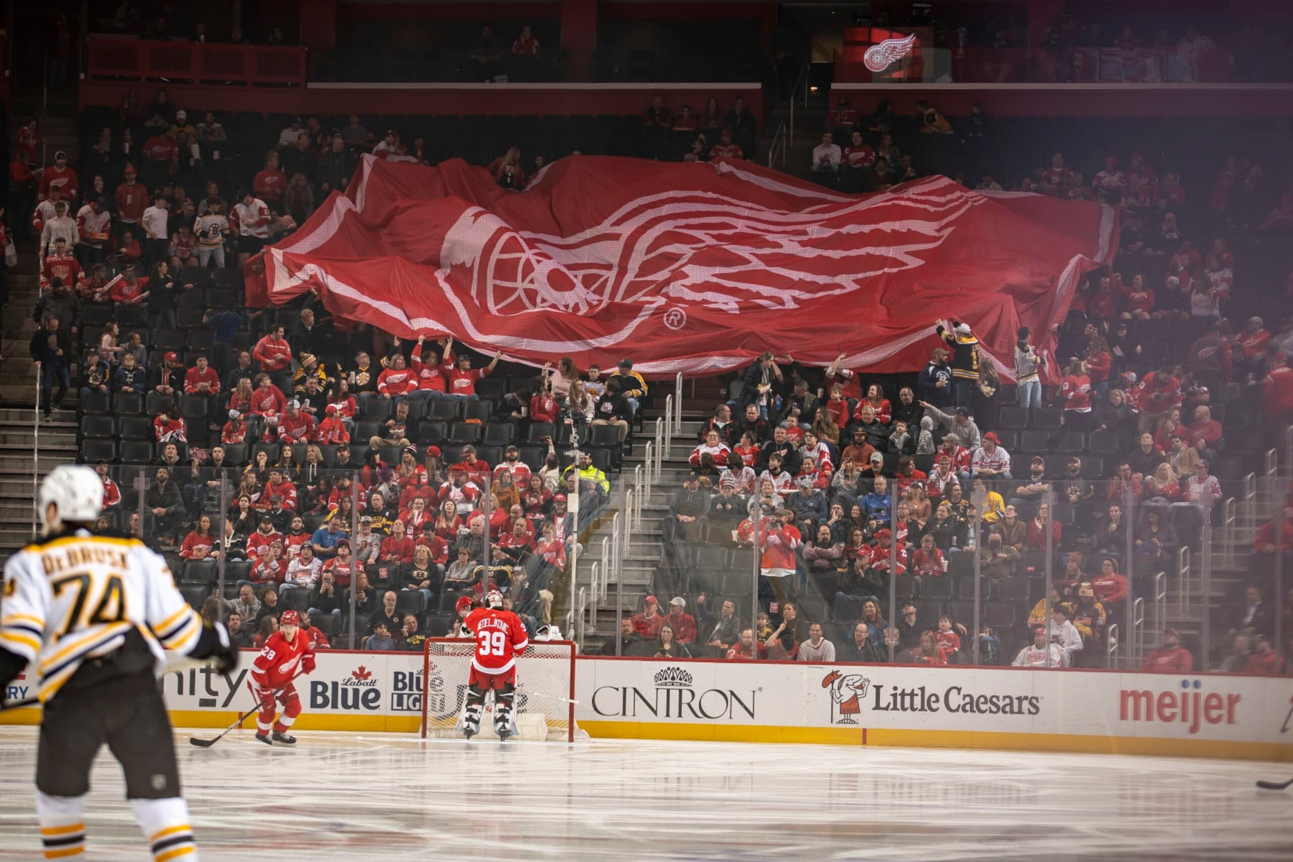 DETROIT, MI - APRIL 05: A large Detroit Red Wings flag is passed over the crowd before the first period of an NHL game against the Boston Bruins at Little Caesars Arena on April 5, 2022 in Detroit, Michigan. (Photo by Dave Reginek/NHLI via Getty Images)