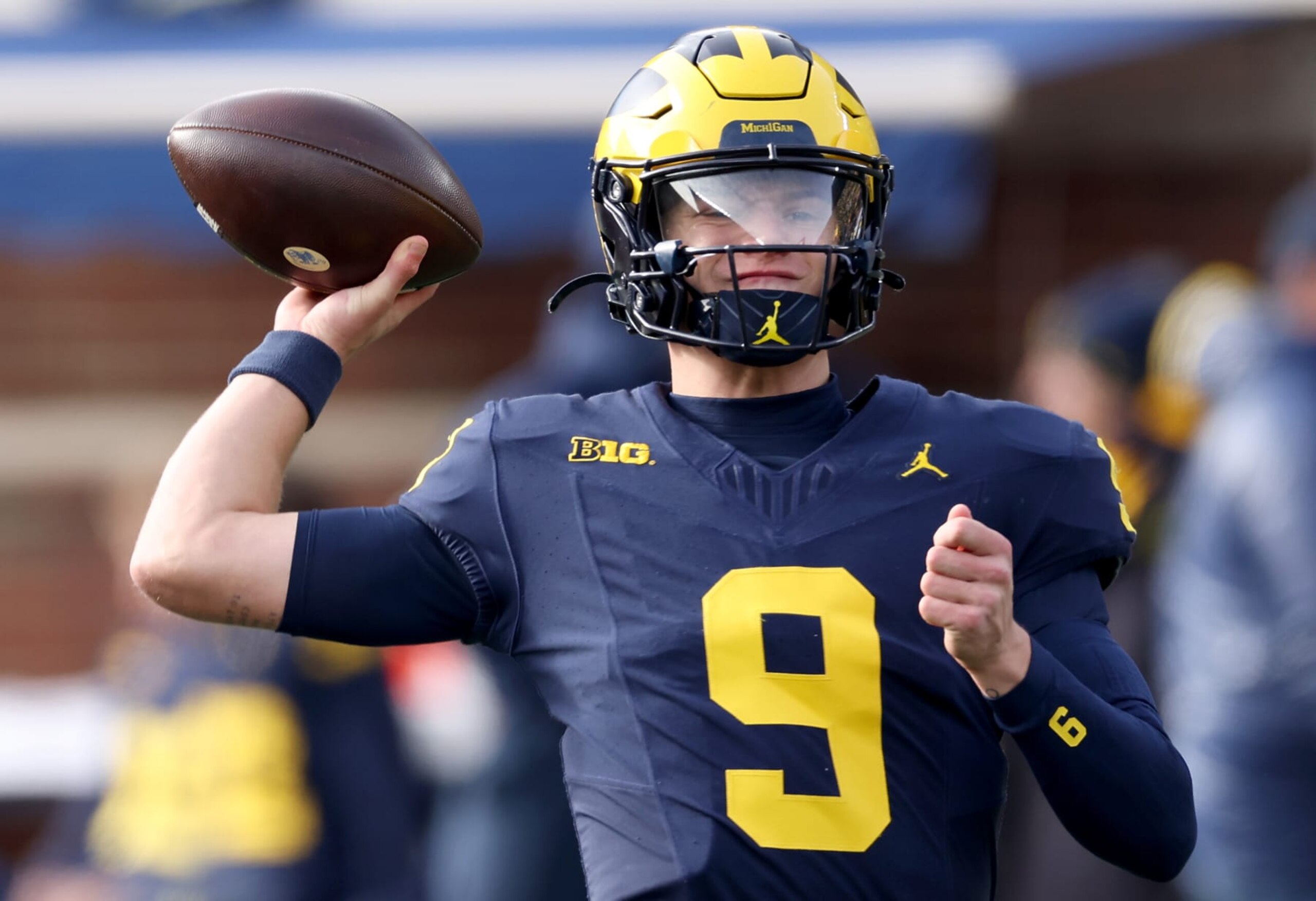 ANN ARBOR, MICHIGAN - NOVEMBER 25: J.J. McCarthy #9 of the Michigan Wolverines warms up prior to the game against the Ohio State Buckeyes at Michigan Stadium on November 25, 2023 in Ann Arbor, Michigan. (Photo by Gregory Shamus/Getty Images)