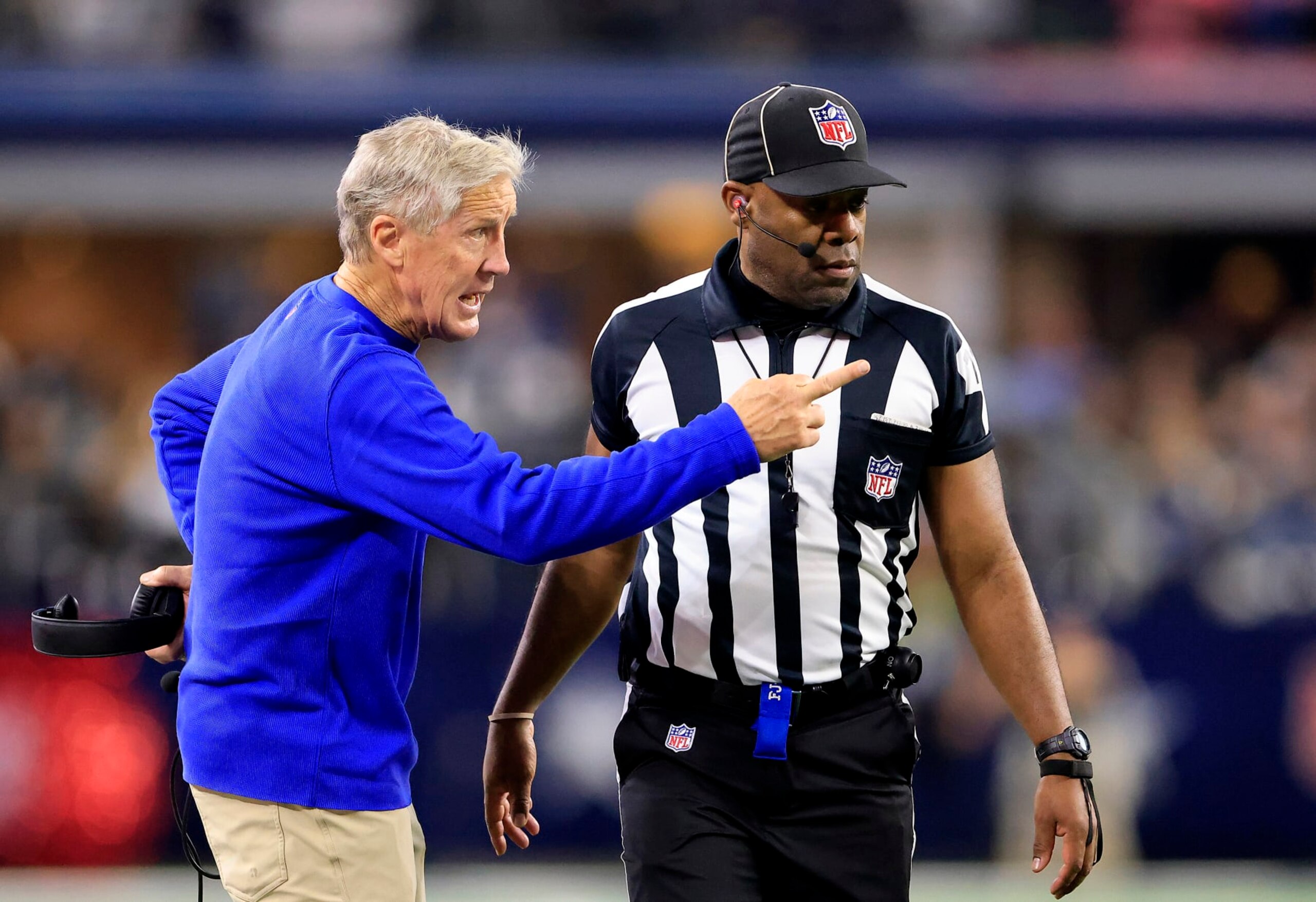 ARLINGTON, TEXAS - NOVEMBER 30: Head coach Pete Carroll of the Seattle Seahawks talks with a referee on the sidelines during the 2nd quarter of the game against the Dallas Cowboys at AT&T Stadium on November 30, 2023 in Arlington, Texas. (Photo by Ron Jenkins/Getty Images) ARLINGTON, TEXAS - NOVEMBER 30: Head coach Pete Carroll of the Seattle Seahawks talks with a referee on the sidelines during the 2nd quarter of the game against the Dallas Cowboys at AT&T Stadium on November 30, 2023 in Arlington, Texas. (Photo by Ron Jenkins/Getty Images)