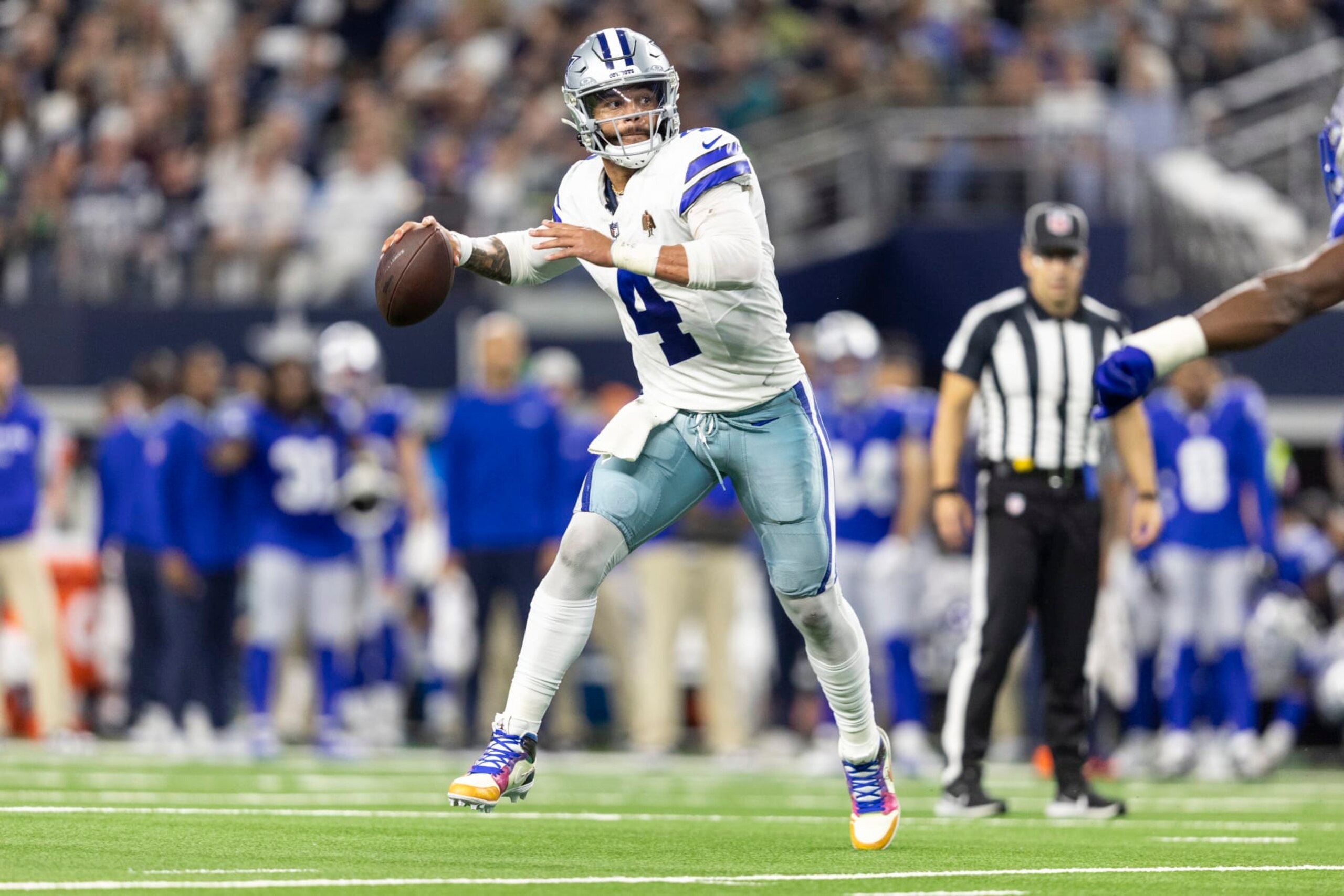ARLINGTON, TEXAS - NOVEMBER 30: Dak Prescott #4 of the Dallas Cowboys scrambles and looks to pass during an NFL football game between the Dallas Cowboys and the Seattle Seahawks at AT&T Stadium on November 30, 2023 in Arlington, Texas. (Photo by Michael Owens/Getty Images) ARLINGTON, TEXAS - NOVEMBER 30: Dak Prescott #4 of the Dallas Cowboys scrambles and looks to pass during an NFL football game between the Dallas Cowboys and the Seattle Seahawks at AT&T Stadium on November 30, 2023 in Arlington, Texas. (Photo by Michael Owens/Getty Images)