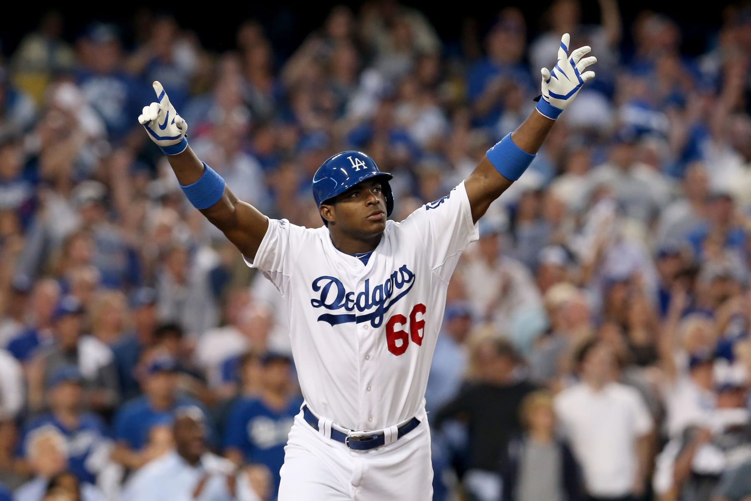 LOS ANGELES, CA - OCTOBER 14: Yasiel Puig #66 of the Los Angeles Dodgers reacts as he hits a RBI triple in the fourth inning against the St. Louis Cardinals in Game Three of the National League Championship Series at Dodger Stadium on October 14, 2013 in Los Angeles, California. (Photo by Stephen Dunn/Getty Images) LOS ANGELES, CA - OCTOBER 14: Yasiel Puig #66 of the Los Angeles Dodgers reacts as he hits a RBI triple in the fourth inning against the St. Louis Cardinals in Game Three of the National League Championship Series at Dodger Stadium on October 14, 2013 in Los Angeles, California. (Photo by Stephen Dunn/Getty Images)