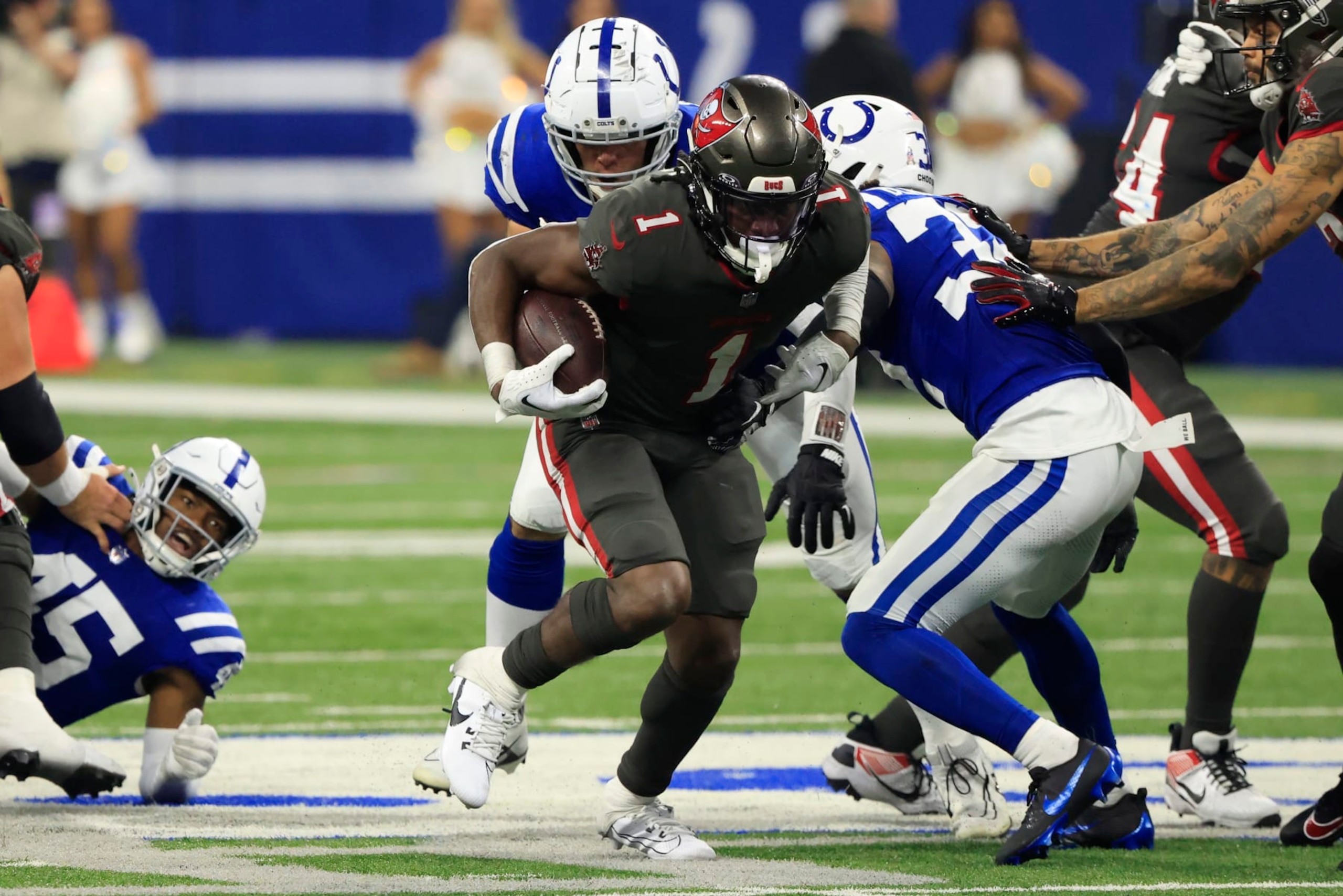 INDIANAPOLIS, INDIANA - NOVEMBER 26: Rachaad White #1 of the Tampa Bay Buccaneers runs the ball in the game against the Indianapolis Colts at Lucas Oil Stadium on November 26, 2023 in Indianapolis, Indiana. (Photo by Justin Casterline/Getty Images) INDIANAPOLIS, INDIANA - NOVEMBER 26: Rachaad White #1 of the Tampa Bay Buccaneers runs the ball in the game against the Indianapolis Colts at Lucas Oil Stadium on November 26, 2023 in Indianapolis, Indiana. (Photo by Justin Casterline/Getty Images)