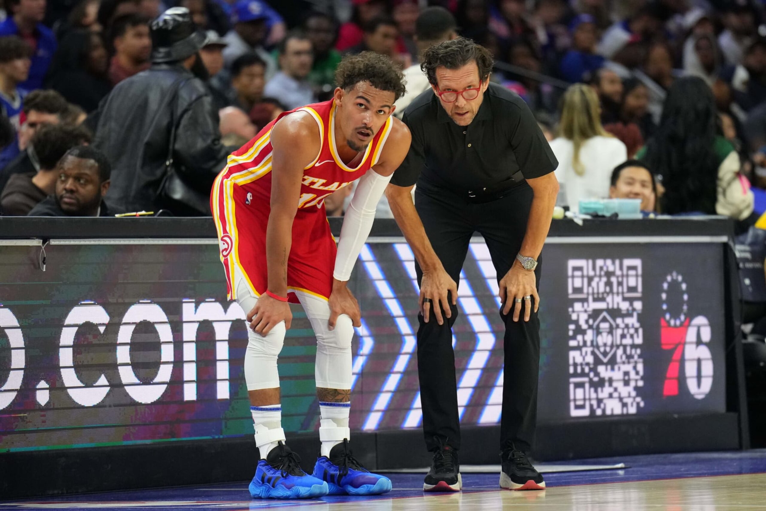 PHILADELPHIA, PA - OCTOBER 20: Trae Young #11 and Head Coach Quin Snyder of the Atlanta Hawks looks on during the game against the Philadelphia 76ers on October 20, 2023 at the Wells Fargo Center in Philadelphia, Pennsylvania NOTE TO USER: User expressly acknowledges and agrees that, by downloading and/or using this Photograph, user is consenting to the terms and conditions of the Getty Images License Agreement. Mandatory Copyright Notice: Copyright 2023 NBAE (Photo by Jesse D. Garrabrant/NBAE via Getty Images)