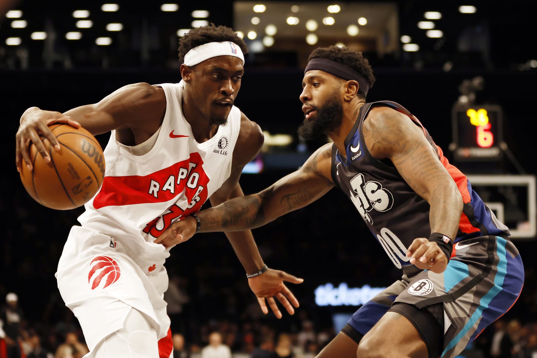 NEW YORK, NEW YORK - NOVEMBER 28: Pascal Siakam #43 of the Toronto Raptors dribbles against Royce O'Neale #00 of the Brooklyn Nets during the first half of an NBA In-Season Tournament game at Barclays Center on November 28, 2023 in the Brooklyn borough of New York City. NOTE TO USER: User expressly acknowledges and agrees that, by downloading and/or using this photograph, User is consenting to the terms and conditions of the Getty Images License Agreement. (Photo by Sarah Stier/Getty Images)
