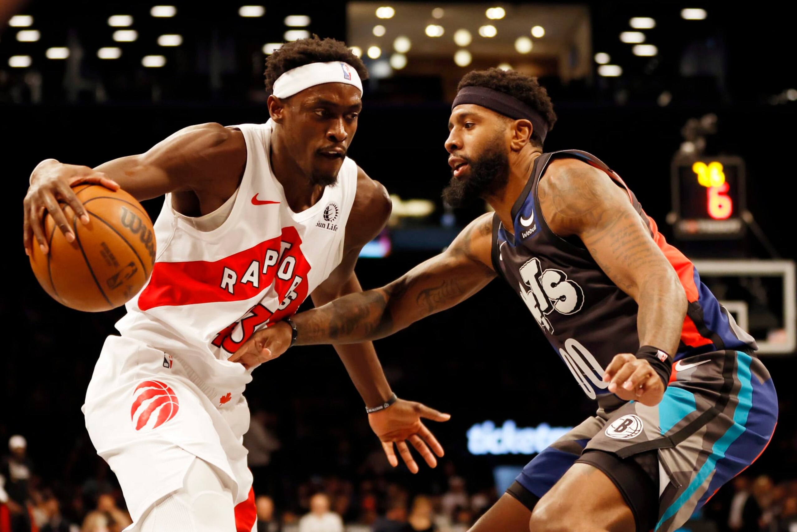 NEW YORK, NEW YORK - NOVEMBER 28: Pascal Siakam #43 of the Toronto Raptors dribbles against Royce O'Neale #00 of the Brooklyn Nets during the first half of an NBA In-Season Tournament game at Barclays Center on November 28, 2023 in the Brooklyn borough of New York City. NOTE TO USER: User expressly acknowledges and agrees that, by downloading and/or using this photograph, User is consenting to the terms and conditions of the Getty Images License Agreement. (Photo by Sarah Stier/Getty Images)