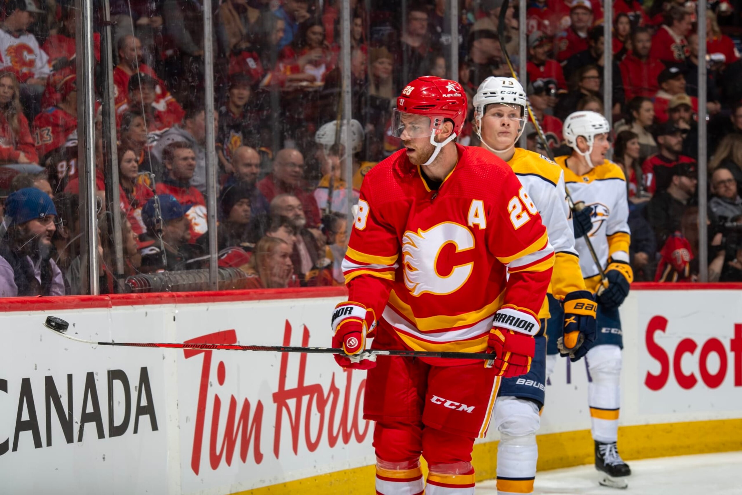 CALGARY, AB - NOVEMBER 7: Elias Lindholm #28 of the Calgary Flames collects the puck against the Nashville Predators at Scotiabank Saddledome on November 7, 2023 in Calgary, Alberta, Canada. (Photo by Terence Leung/NHLI via Getty Images) CALGARY, AB - NOVEMBER 7: Elias Lindholm #28 of the Calgary Flames collects the puck against the Nashville Predators at Scotiabank Saddledome on November 7, 2023 in Calgary, Alberta, Canada. (Photo by Terence Leung/NHLI via Getty Images)