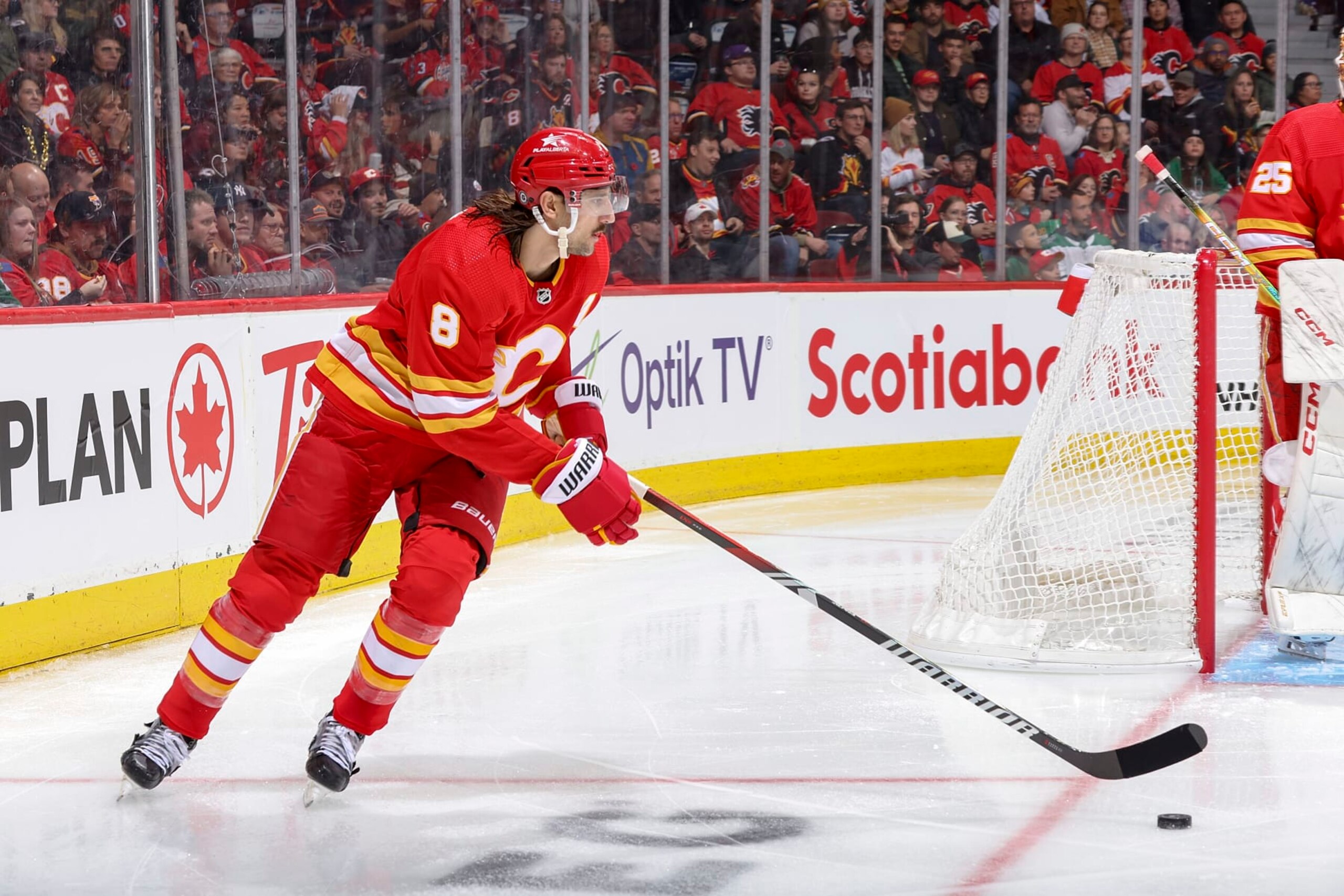 CALGARY, AB - NOVEMBER 1: Christopher Tanev #8 of the Calgary Flames skates with the puck against the Dallas Stars at Scotiabank Saddledome on November 1, 2023 in Calgary, Alberta, Canada. (Photo by Gerry Thomas/NHLI via Getty Images) CALGARY, AB - NOVEMBER 1: Christopher Tanev #8 of the Calgary Flames skates with the puck against the Dallas Stars at Scotiabank Saddledome on November 1, 2023 in Calgary, Alberta, Canada. (Photo by Gerry Thomas/NHLI via Getty Images)