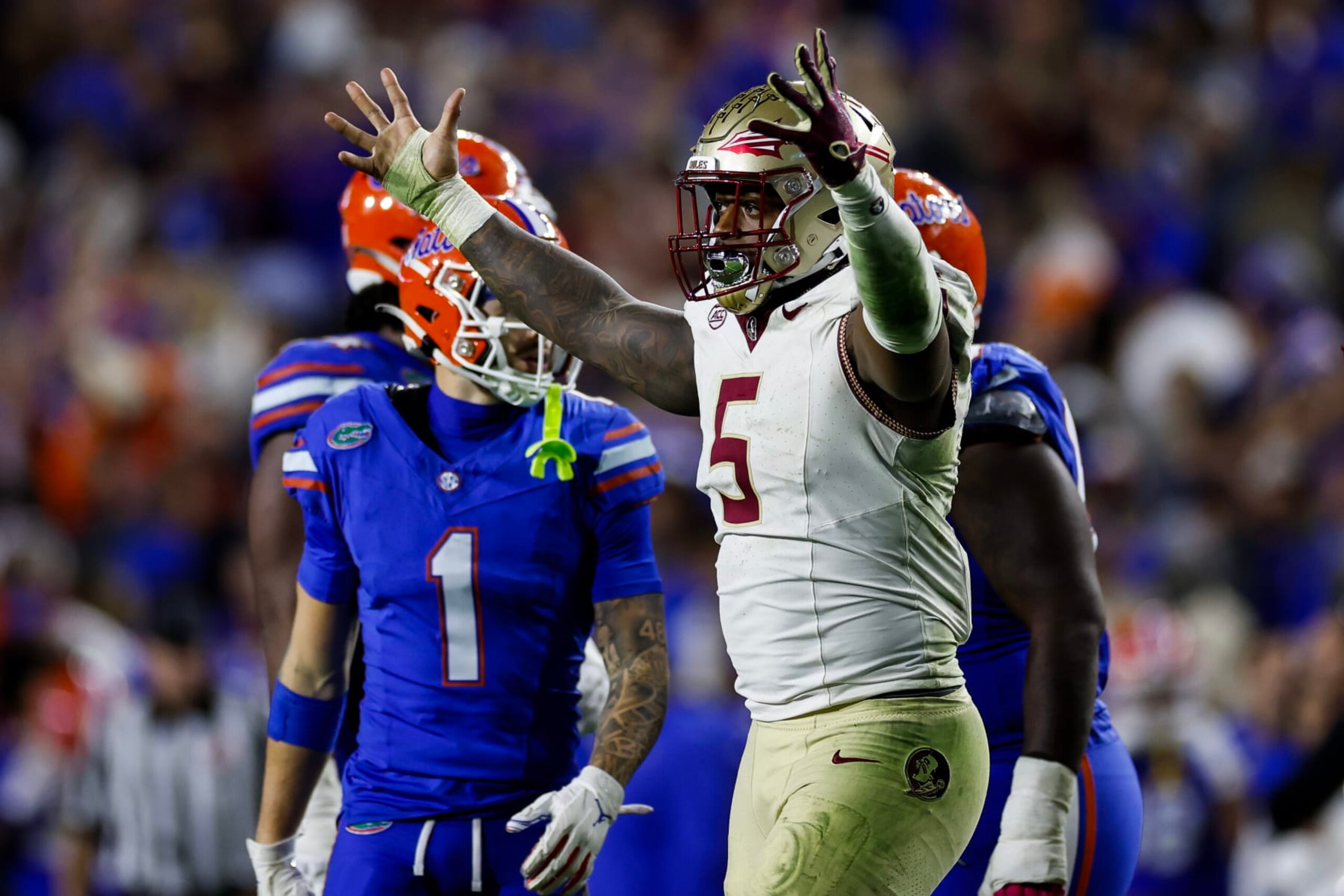 GAINESVILLE, FLORIDA - NOVEMBER 25: Jared Verse #5 of the Florida State Seminoles celebrates a sack during the second half of a game against the Florida Gators at Ben Hill Griffin Stadium on November 25, 2023 in Gainesville, Florida. (Photo by James Gilbert/Getty Images)