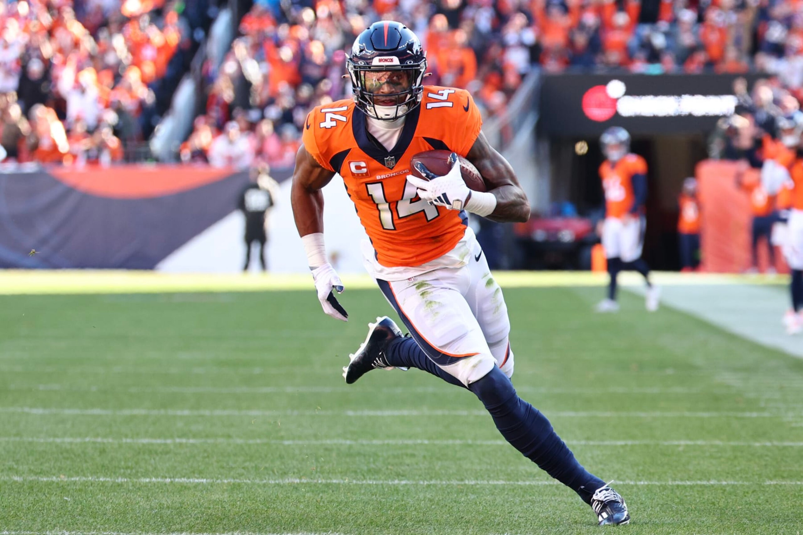 DENVER, COLORADO - NOVEMBER 26: Courtland Sutton #14 of the Denver Broncos carries the ball against the Cleveland Browns during the first half of the game at Empower Field At Mile High on November 26, 2023 in Denver, Colorado. (Photo by Jamie Schwaberow/Getty Images)
