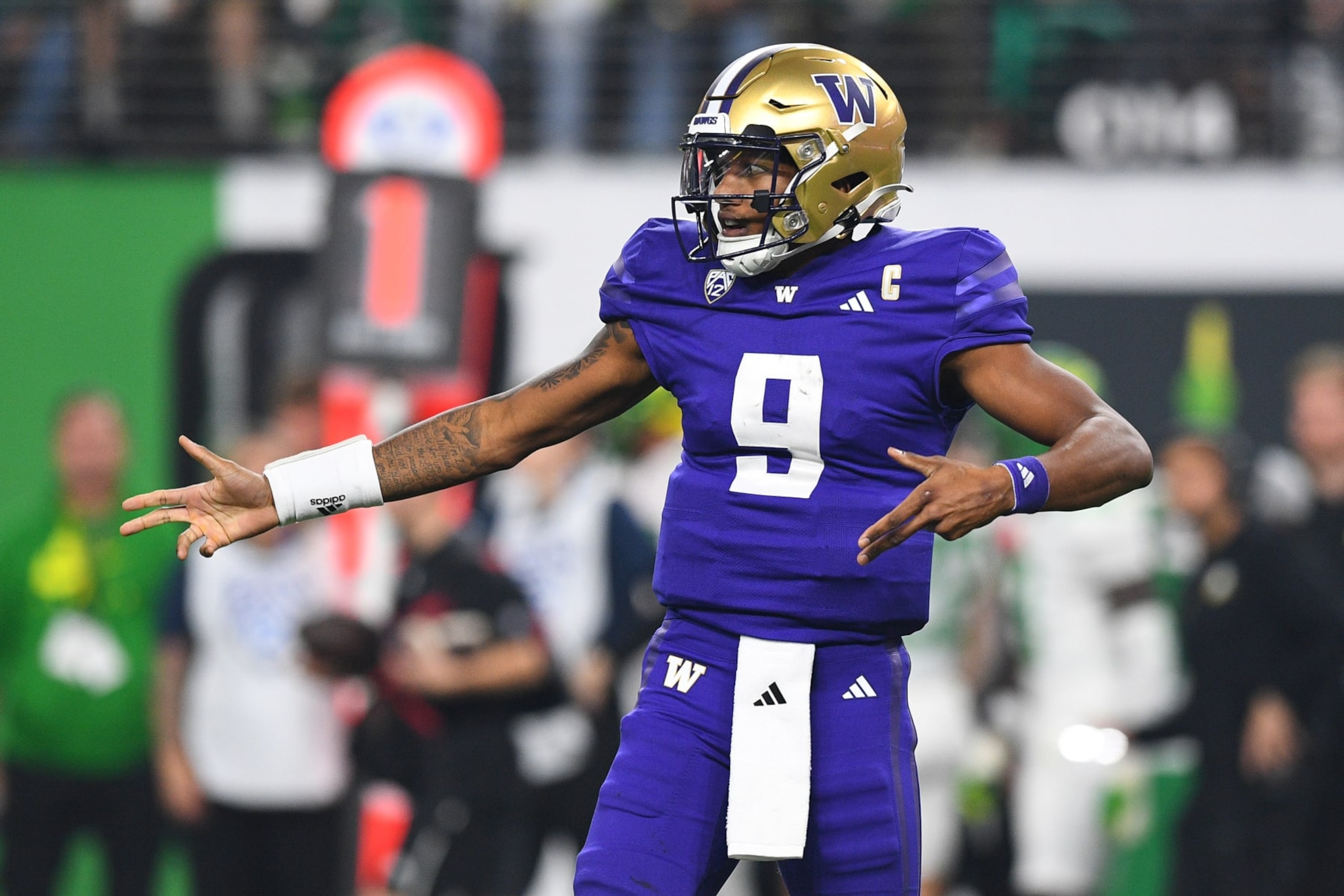 LAS VEGAS, NV - DECEMBER 01: Washington Huskies quarterback Michael Penix Jr. (9) celebrates after a pass pass during the Pac-12 Conference championship game between the Oregon Ducks and the Washington Huskies on December 1, 2023 at Allegiant Stadium in Las Vegas, Nevada. (Photo by Brian Rothmuller/Icon Sportswire via Getty Images)