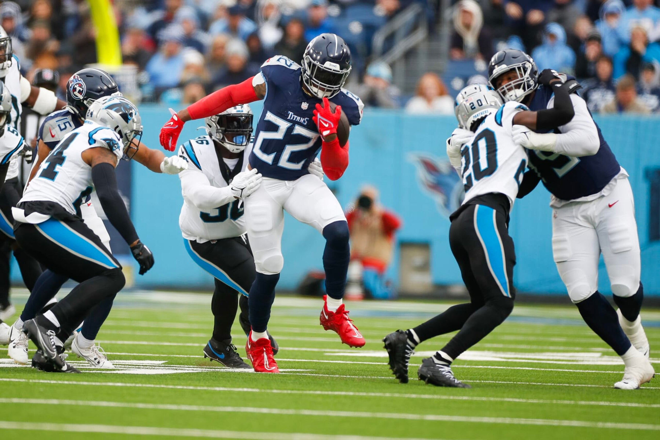 NASHVILLE, TENNESSEE - NOVEMBER 26: DeShawn Williams #96 of the Carolina Panthers attempts to tackle Derrick Henry #22 of the Tennessee Titans during the first quarterat Nissan Stadium on November 26, 2023 in Nashville, Tennessee. (Photo by Silas Walker/Getty Images) NASHVILLE, TENNESSEE - NOVEMBER 26: DeShawn Williams #96 of the Carolina Panthers attempts to tackle Derrick Henry #22 of the Tennessee Titans during the first quarterat Nissan Stadium on November 26, 2023 in Nashville, Tennessee. (Photo by Silas Walker/Getty Images)