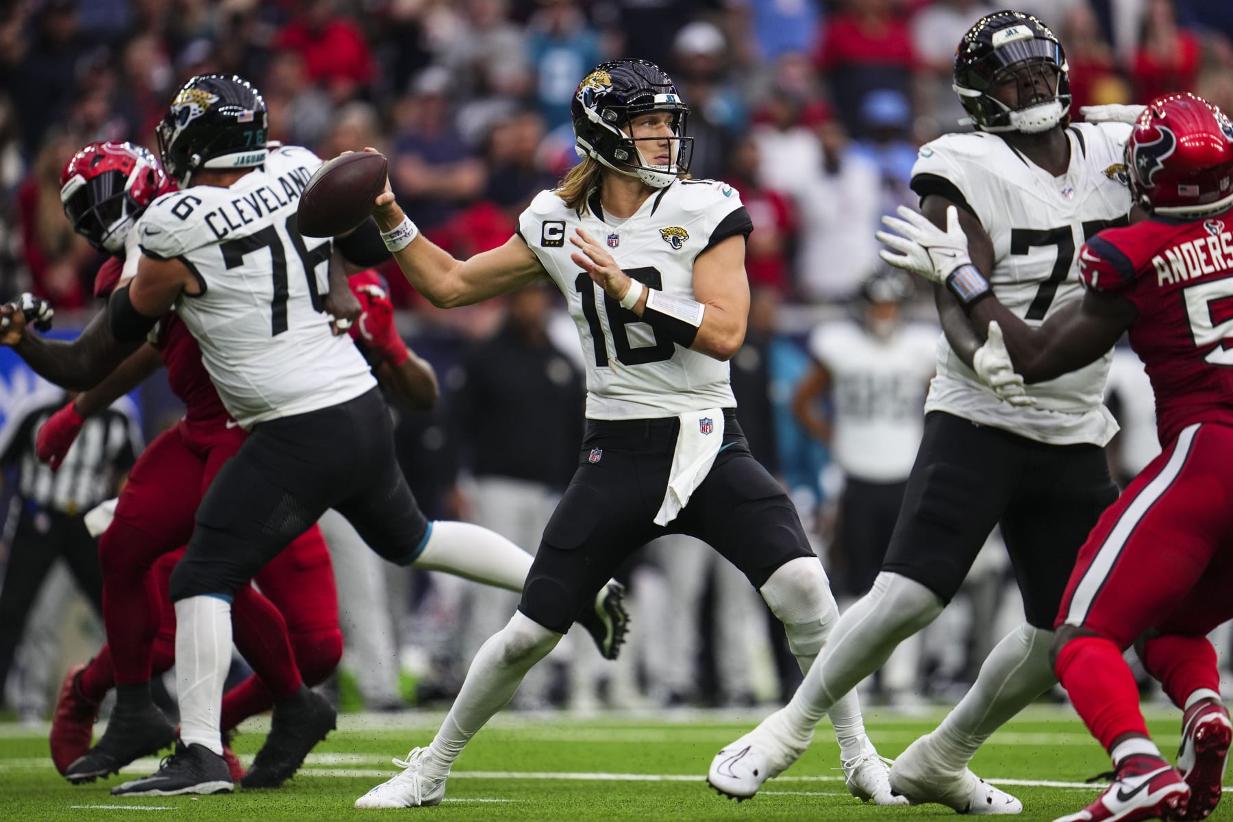 HOUSTON, TX - NOVEMBER 26: Trevor Lawrence #16 of the Jacksonville Jaguars throws the ball during an NFL football game against the Houston Texans at NRG Stadium on November 26, 2023 in Houston, Texas. (Photo by Cooper Neill/Getty Images)