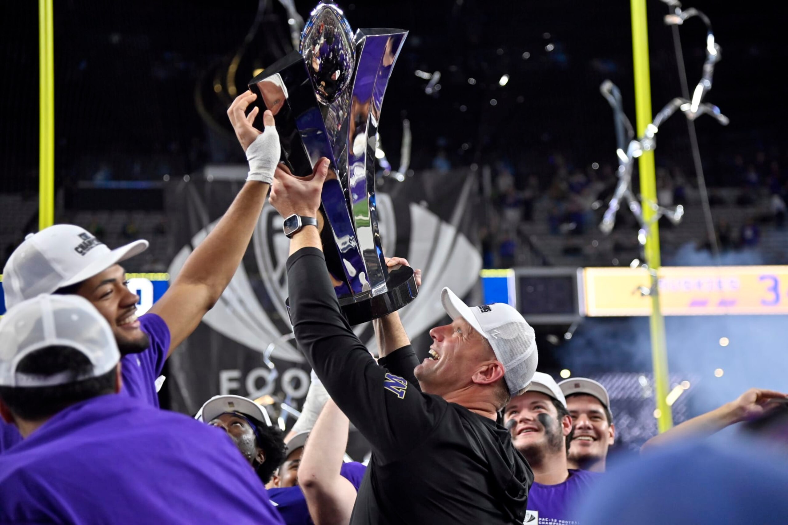 Washington coach Kalen DeBoer celebrates with the trophy after the team's win over Oregon in the Pac-12 championship NCAA college football game Friday, Dec. 1, 2023, in Las Vegas. (AP Photo/David Becker)