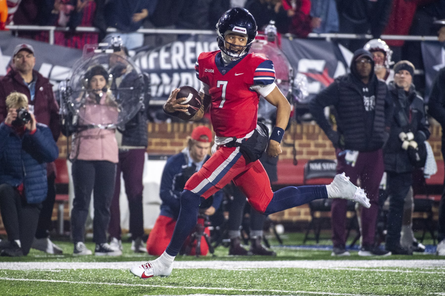 Liberty's Kaidon Salter runs for a touchdown against New Mexico State during the second half of the Conference USA championship NCAA college football game Friday, Dec. 1, 2023, in Lynchburg, Va. (AP Photo/Robert Simmons)