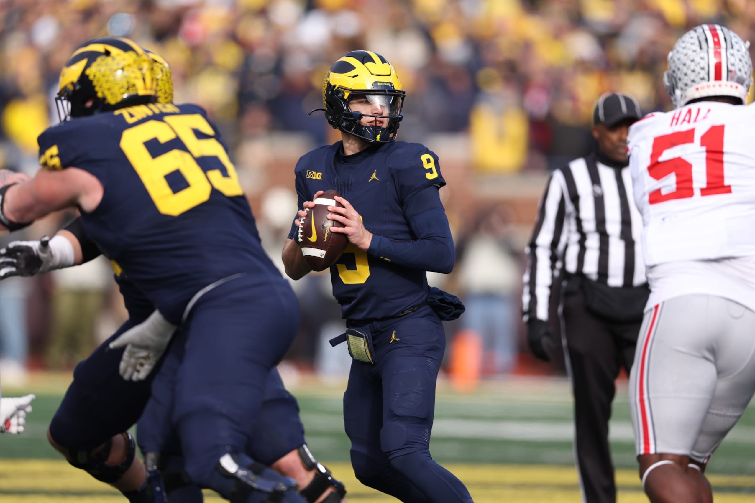 ANN ARBOR, MICHIGAN - NOVEMBER 25: J.J. McCarthy #9 of the Michigan Wolverines plays against the Ohio State Buckeyes at Michigan Stadium on November 25, 2023 in Ann Arbor, Michigan. (Photo by Gregory Shamus/Getty Images)