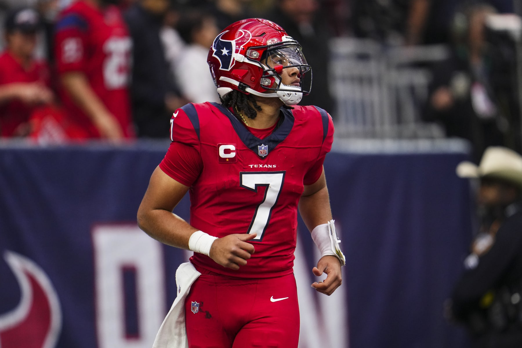 HOUSTON, TX - NOVEMBER 26: C.J. Stroud #7 of the Houston Texans looks on from the field during an NFL football game against the Jacksonville Jaguars at NRG Stadium on November 26, 2023 in Houston, Texas. (Photo by Cooper Neill/Getty Images)