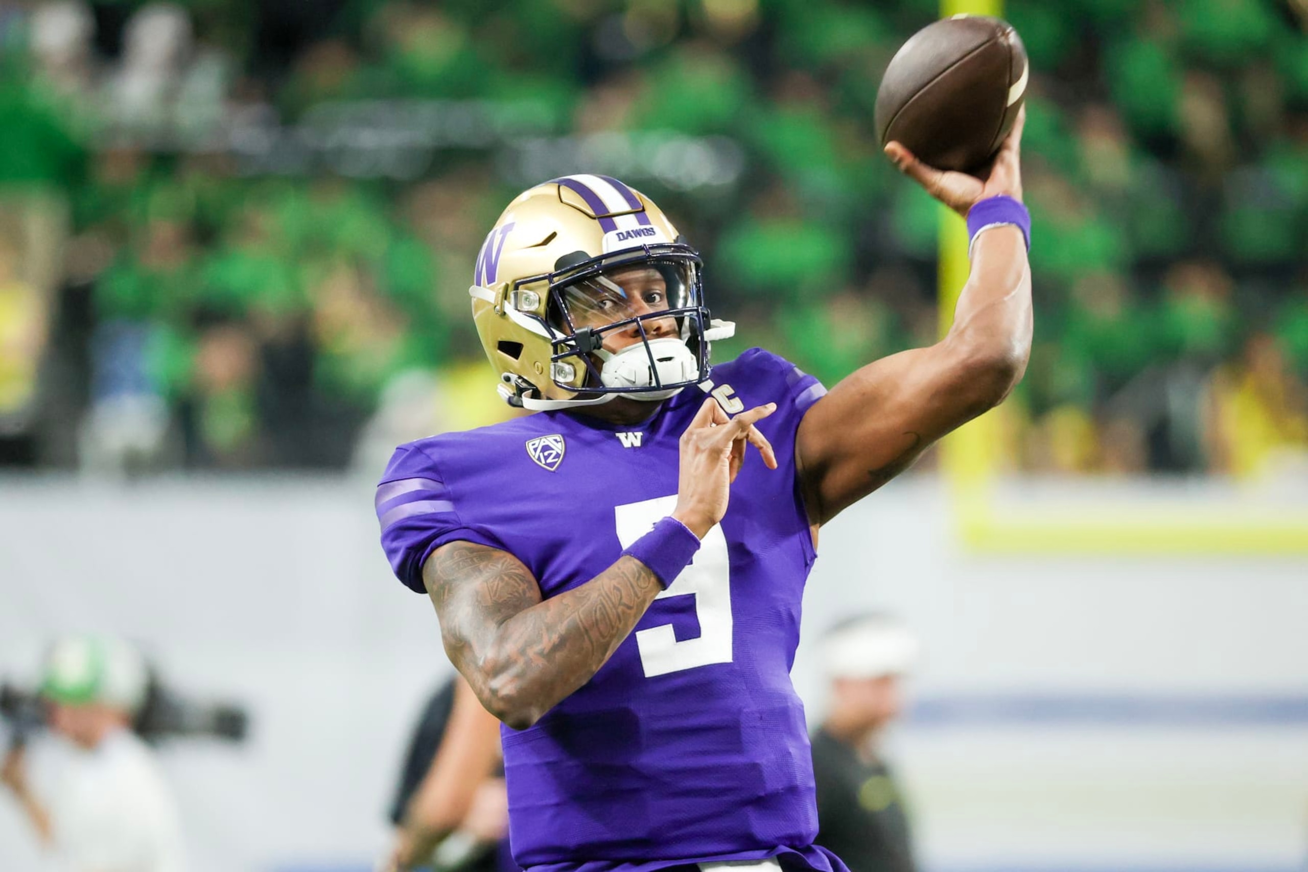 LAS VEGAS, NEVADA - DECEMBER 01: Michael Penix Jr. #9 of the Washington Huskies warms up prior to a game against the Oregon Ducks during the Pac-12 Championship at Allegiant Stadium on December 01, 2023 in Las Vegas, Nevada. (Photo by Ian Maule/Getty Images)