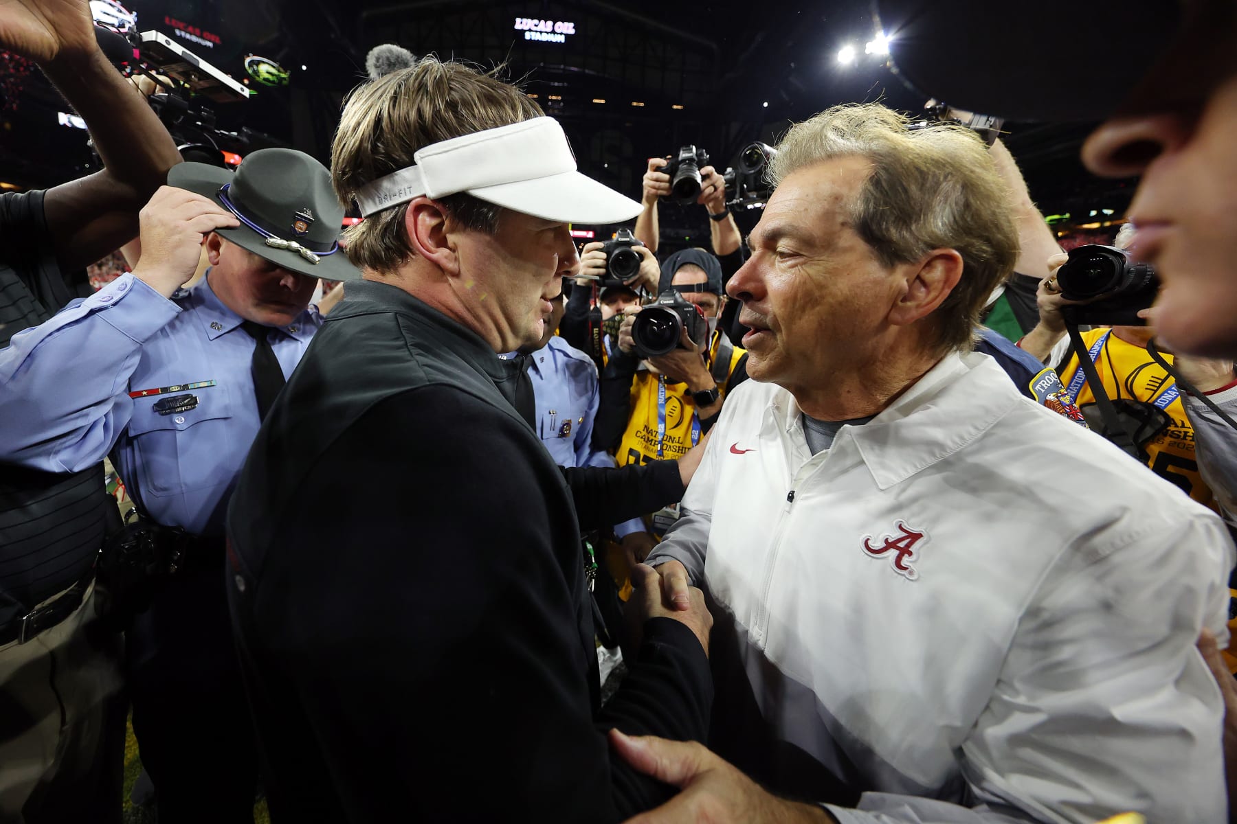 INDIANAPOLIS, INDIANA - JANUARY 10: Head Coach Nick Saban of the Alabama Crimson Tide and Head Coach Kirby Smart of the Georgia Bulldogs shake hands after the Georgia Bulldogs defeated the Alabama Crimson Tide 33-18 in the 2022 CFP National Championship Game at Lucas Oil Stadium on January 10, 2022 in Indianapolis, Indiana. (Photo by Kevin C. Cox/Getty Images)