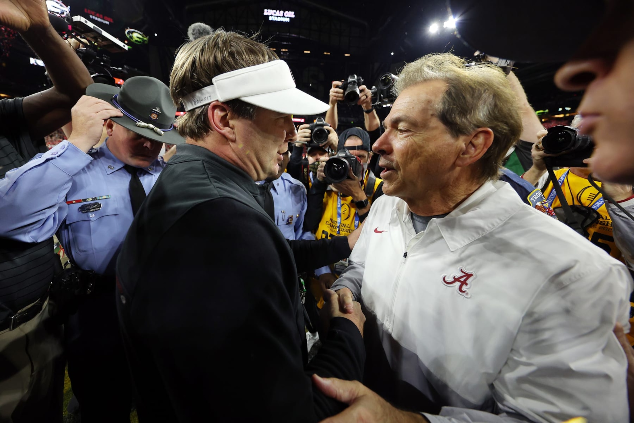 INDIANAPOLIS, INDIANA - JANUARY 10: Head Coach Nick Saban of the Alabama Crimson Tide and Head Coach Kirby Smart of the Georgia Bulldogs shake hands after the Georgia Bulldogs defeated the Alabama Crimson Tide 33-18 in the 2022 CFP National Championship Game at Lucas Oil Stadium on January 10, 2022 in Indianapolis, Indiana. (Photo by Kevin C. Cox/Getty Images)