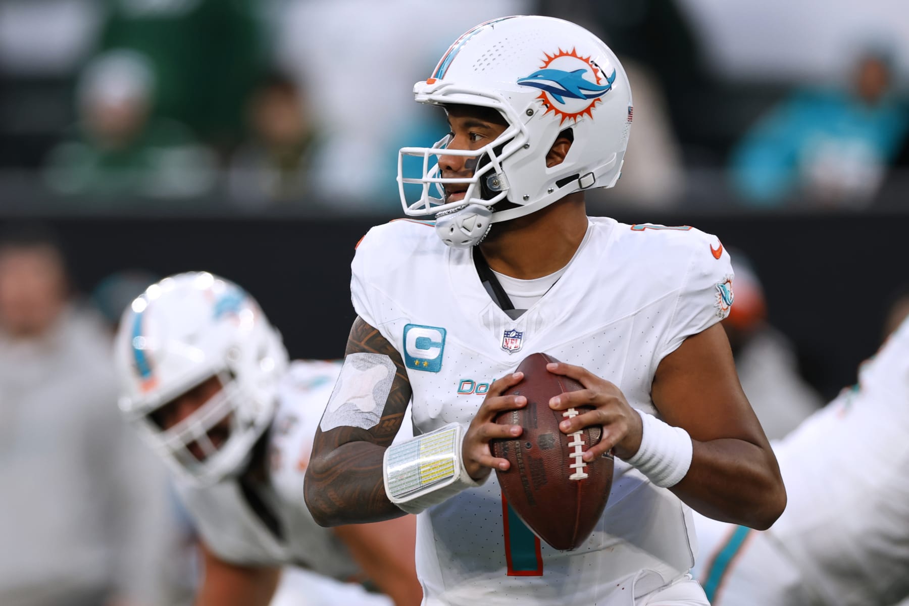 EAST RUTHERFORD, NEW JERSEY - NOVEMBER 24: Quarterback Tua Tagovailoa #1 of the Miami Dolphins in action against the New York Jets during a football game at MetLife Stadium on November 24, 2023 in East Rutherford, New Jersey. (Photo by Rich Schultz/Getty Images)