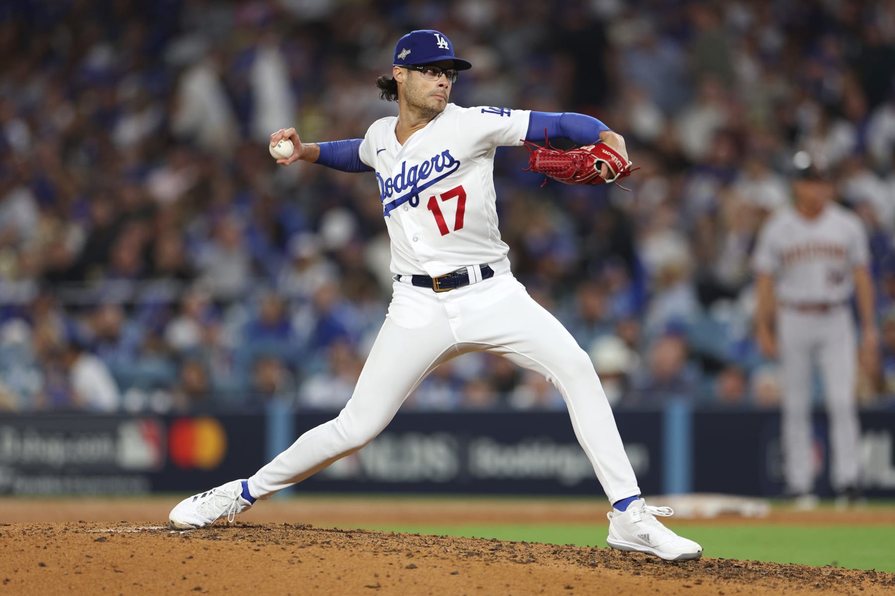 LOS ANGELES, CALIFORNIA - OCTOBER 09: Joe Kelly #17 of the Los Angeles Dodgers pitches against the Arizona Diamondbacks during the seventh inning in Game Two of the Division Series at Dodger Stadium on October 09, 2023 in Los Angeles, California. (Photo by Harry How/Getty Images)
