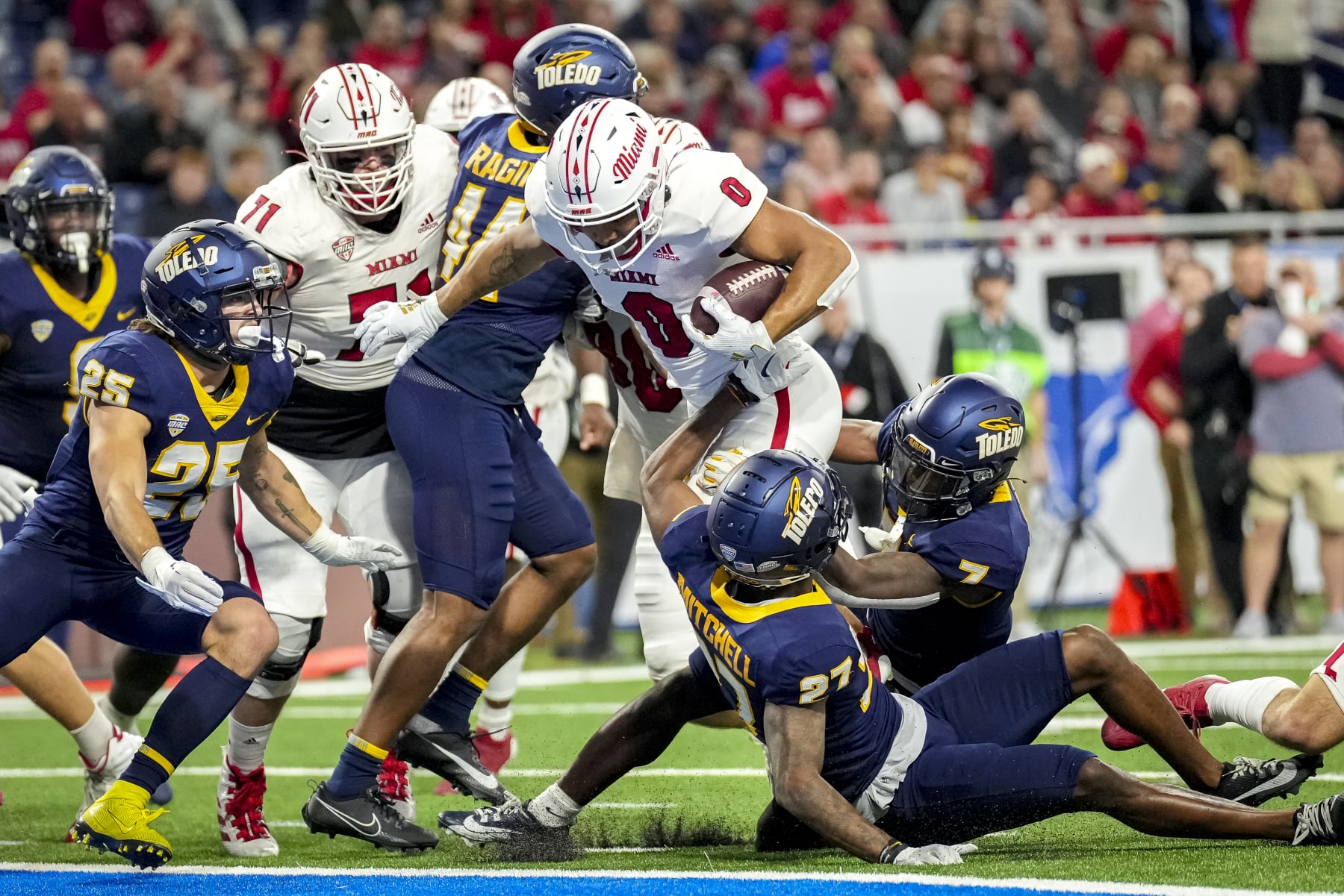 DETROIT, MICHIGAN - DECEMBER 02: Rashad Amos #0 of the Miami (Oh) Redhawks scores a touchdown against the Toledo Rockets during the first quarter of the MAC Championship at Ford Field on December 02, 2023 in Detroit, Michigan. (Photo by Nic Antaya/Getty Images)