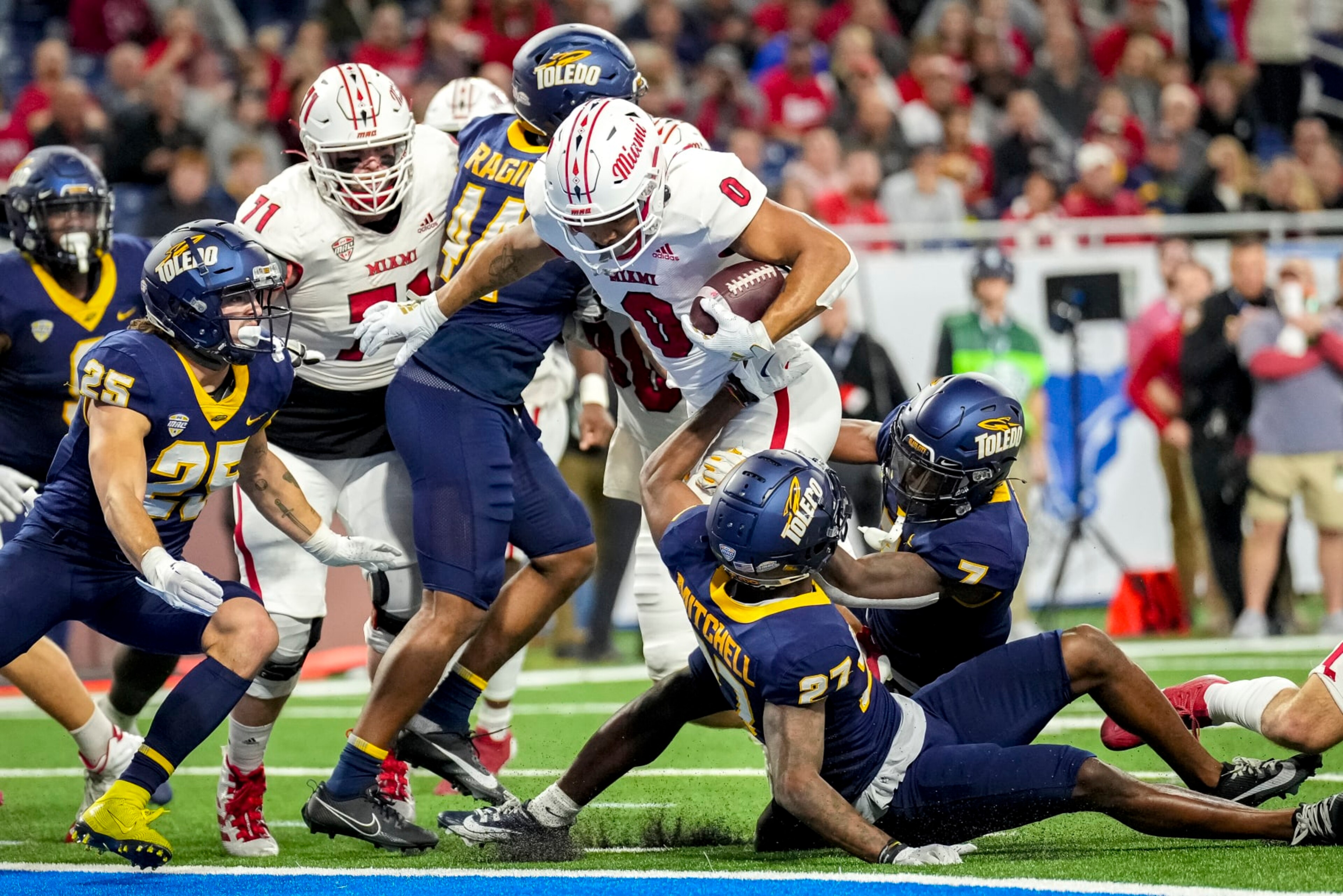 DETROIT, MICHIGAN - DECEMBER 02: Rashad Amos #0 of the Miami (Oh) Redhawks scores a touchdown against the Toledo Rockets during the first quarter of the MAC Championship at Ford Field on December 02, 2023 in Detroit, Michigan. (Photo by Nic Antaya/Getty Images)