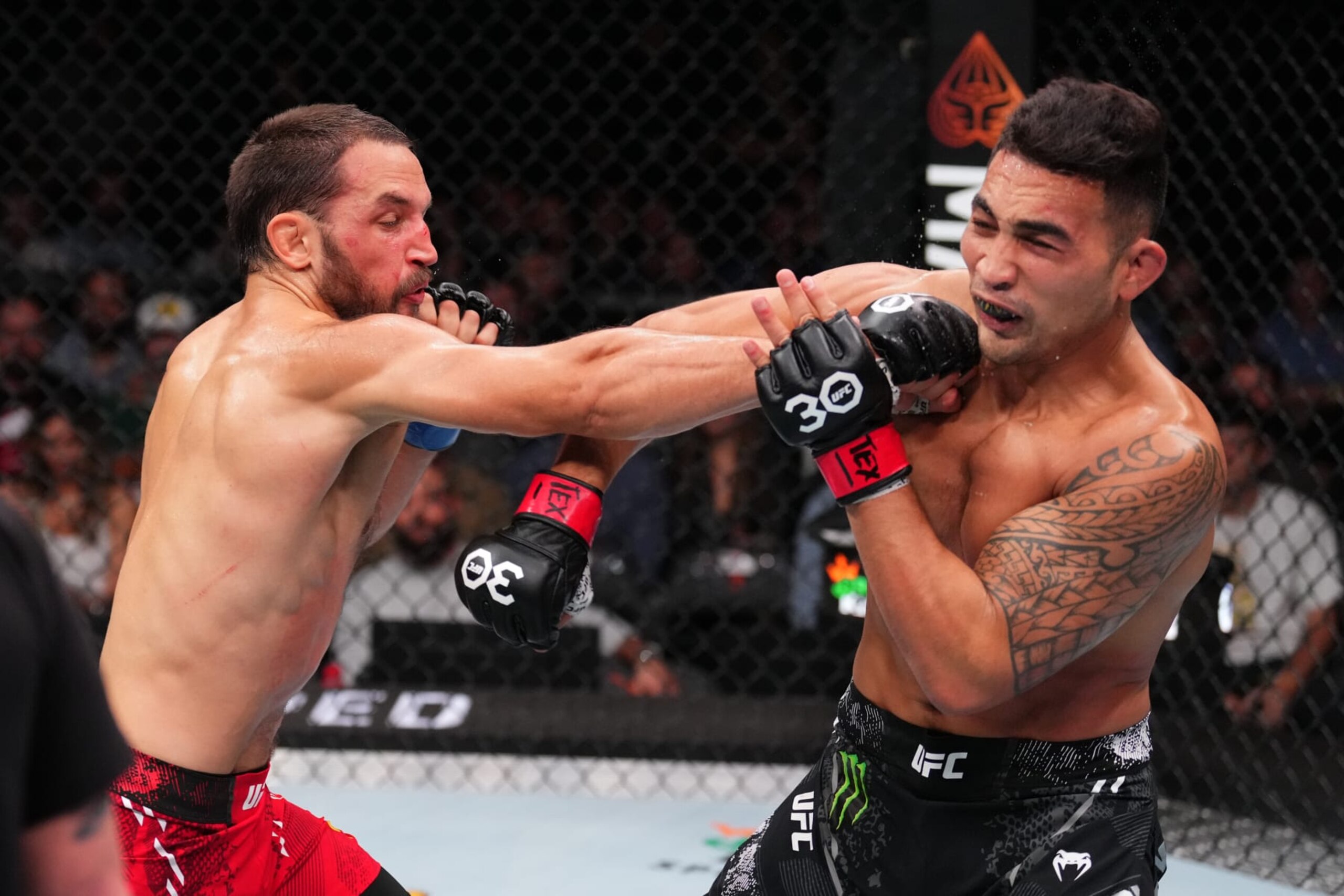 AUSTIN, TEXAS - DECEMBER 02: (L-R) Dustin Stoltzfus punches Punahele Soriano in a middleweight fight during the UFC Fight Night event at Moody Center on December 02, 2023 in Austin, Texas. (Photo by Josh Hedges/Zuffa LLC via Getty Images)