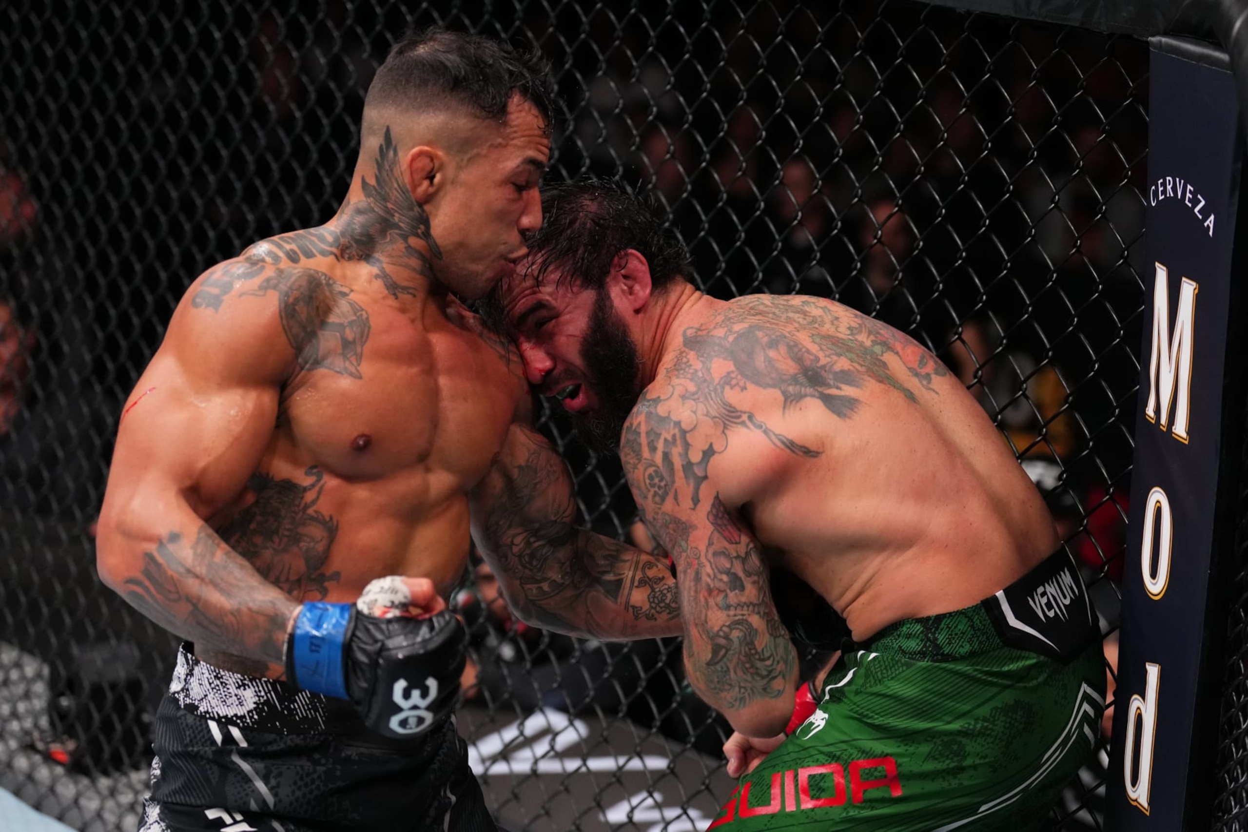 AUSTIN, TEXAS - DECEMBER 02:  (L-R) Joaquim Silva of Brazil punches Clay Guida in a lightweight fight during the UFC Fight Night event at Moody Center on December 02, 2023 in Austin, Texas. (Photo by Josh Hedges/Zuffa LLC via Getty Images)