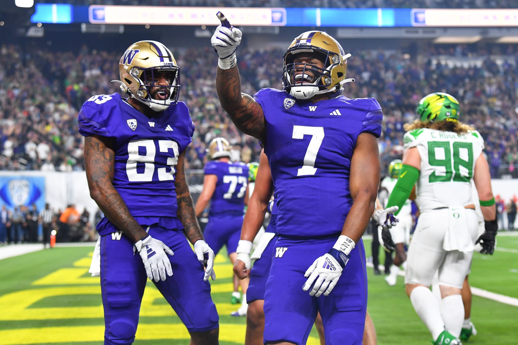 LAS VEGAS, NV - DECEMBER 01: Washington Huskies running back Dillon Johnson (7) celebrates with Washington Huskies tight end Devin Culp (83) after scoring a touchdown during the Pac-12 Conference championship game between the Oregon Ducks and the Washington Huskies on December 1, 2023 at Allegiant Stadium in Las Vegas, Nevada. (Photo by Brian Rothmuller/Icon Sportswire via Getty Images)