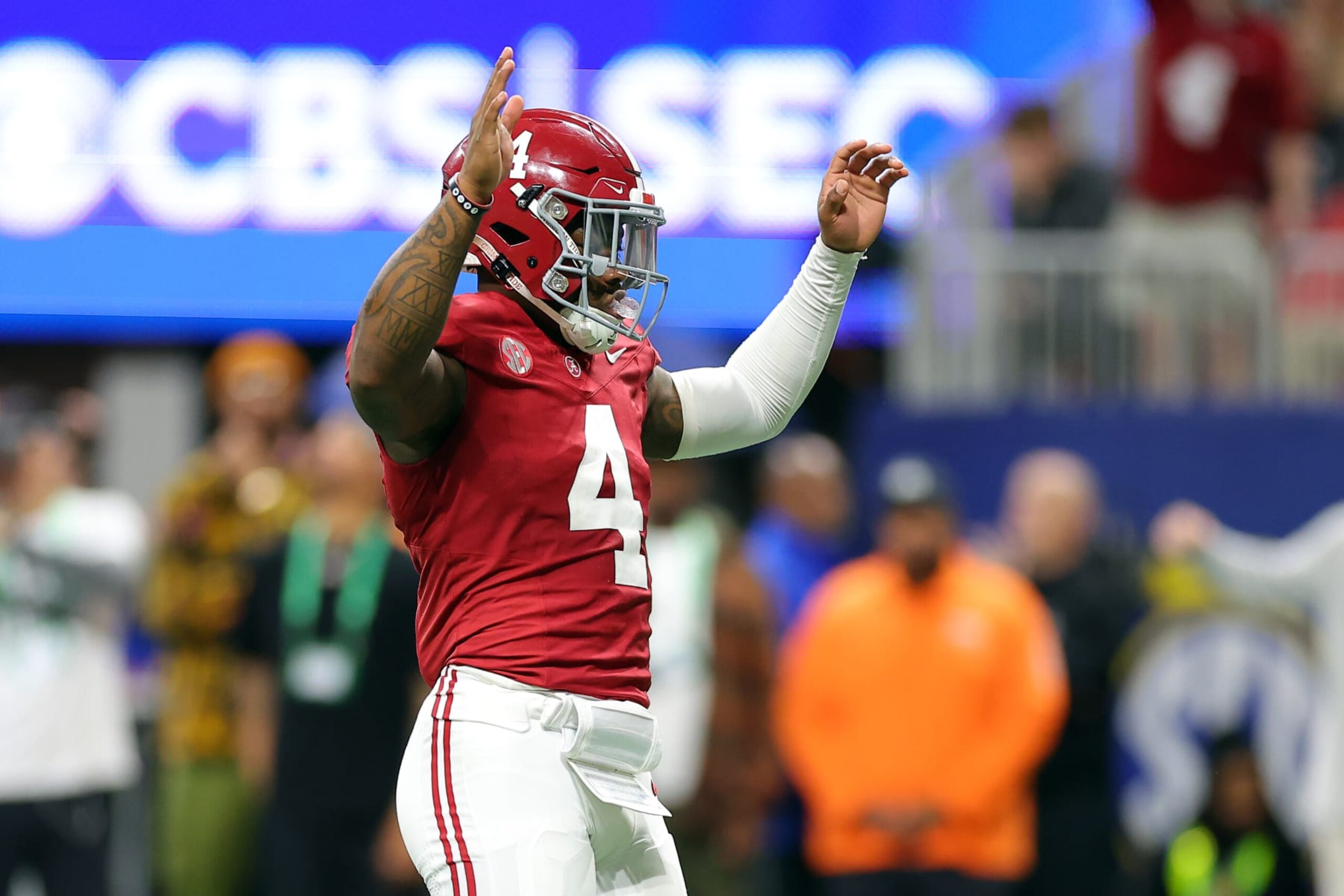 ATLANTA, GEORGIA - DECEMBER 02: Jalen Milroe #4 of the Alabama Crimson Tide celebrates a touchdown during the fourth quarter against the Georgia Bulldogs in the SEC Championship at Mercedes-Benz Stadium on December 02, 2023 in Atlanta, Georgia. (Photo by Kevin C. Cox/Getty Images) ATLANTA, GEORGIA - DECEMBER 02: Jalen Milroe #4 of the Alabama Crimson Tide celebrates a touchdown during the fourth quarter against the Georgia Bulldogs in the SEC Championship at Mercedes-Benz Stadium on December 02, 2023 in Atlanta, Georgia. (Photo by Kevin C. Cox/Getty Images)