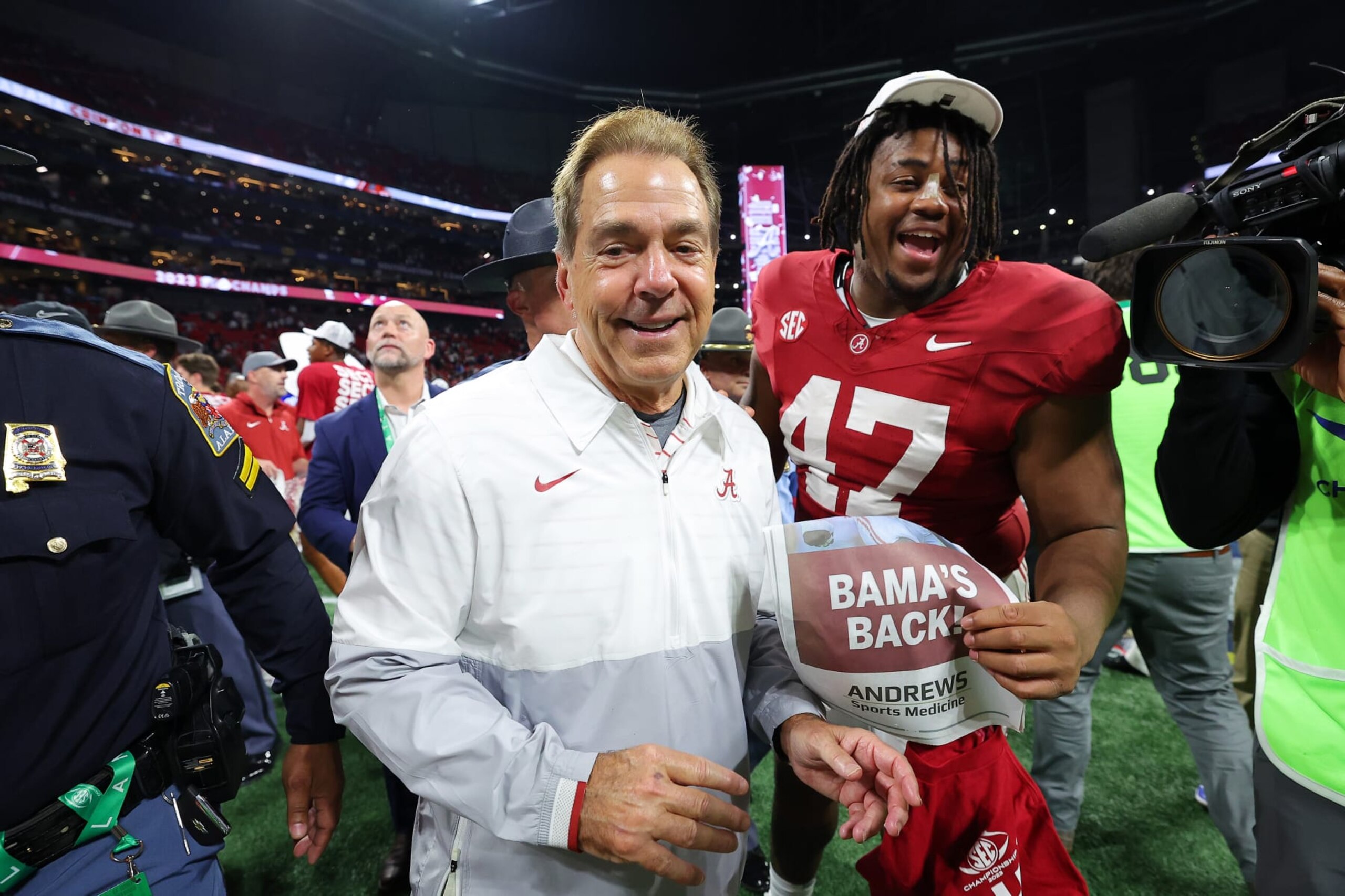 ATLANTA, GEORGIA - DECEMBER 02: Head coach Nick Saban and James Smith #47 of the Alabama Crimson Tide celebrate after defeating the Georgia Bulldogs 27-24 in the SEC Championship at Mercedes-Benz Stadium on December 02, 2023 in Atlanta, Georgia. (Photo by Kevin C. Cox/Getty Images) ATLANTA, GEORGIA - DECEMBER 02: Head coach Nick Saban and James Smith #47 of the Alabama Crimson Tide celebrate after defeating the Georgia Bulldogs 27-24 in the SEC Championship at Mercedes-Benz Stadium on December 02, 2023 in Atlanta, Georgia. (Photo by Kevin C. Cox/Getty Images)