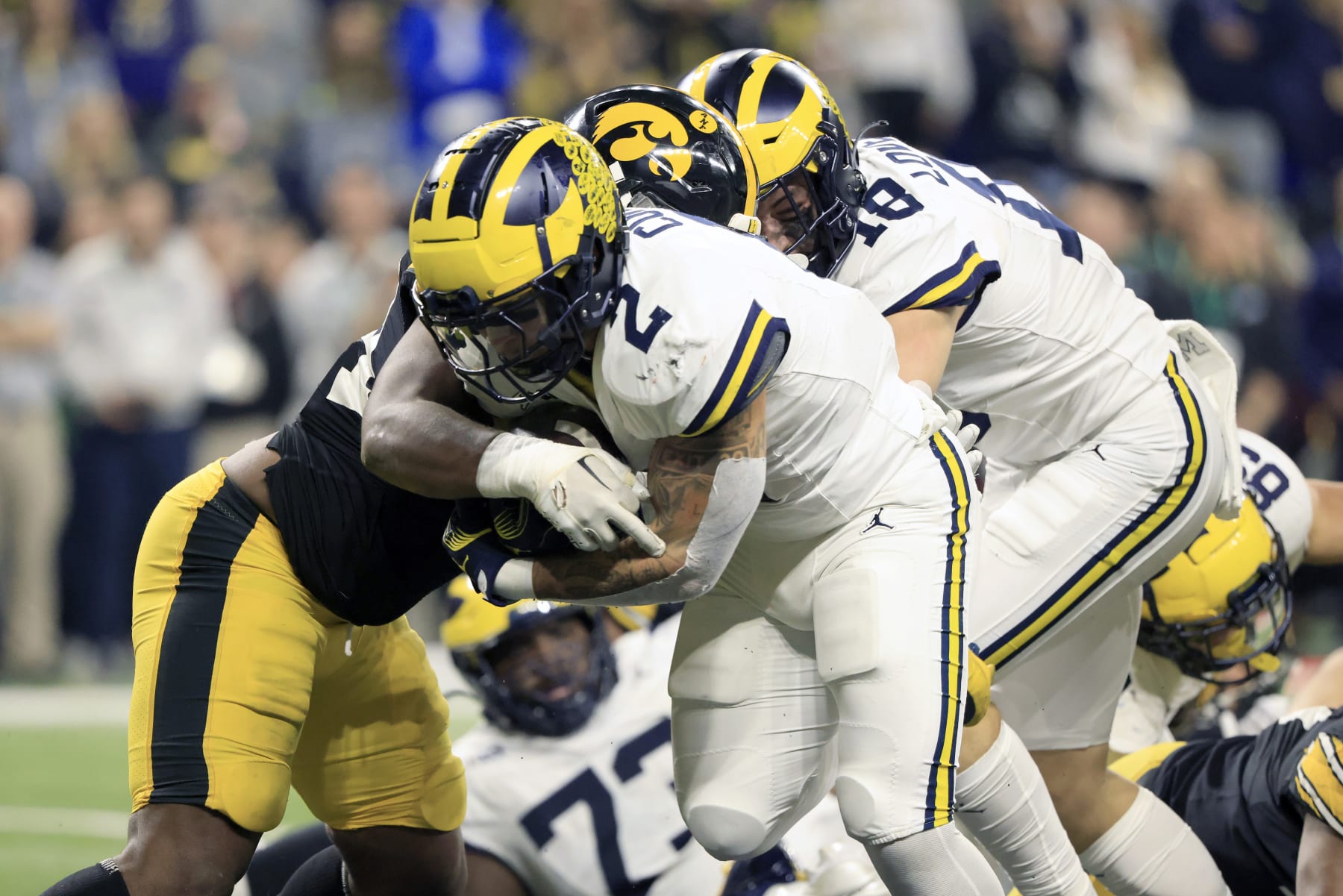 INDIANAPOLIS, INDIANA - DECEMBER 02: Blake Corum #2 of the Michigan Wolverines runs the ball for a touchdown in the game against the Iowa Hawkeyes during the first quarter during the Big Ten Championship at Lucas Oil Stadium on December 02, 2023 in Indianapolis, Indiana. (Photo by Justin Casterline/Getty Images)