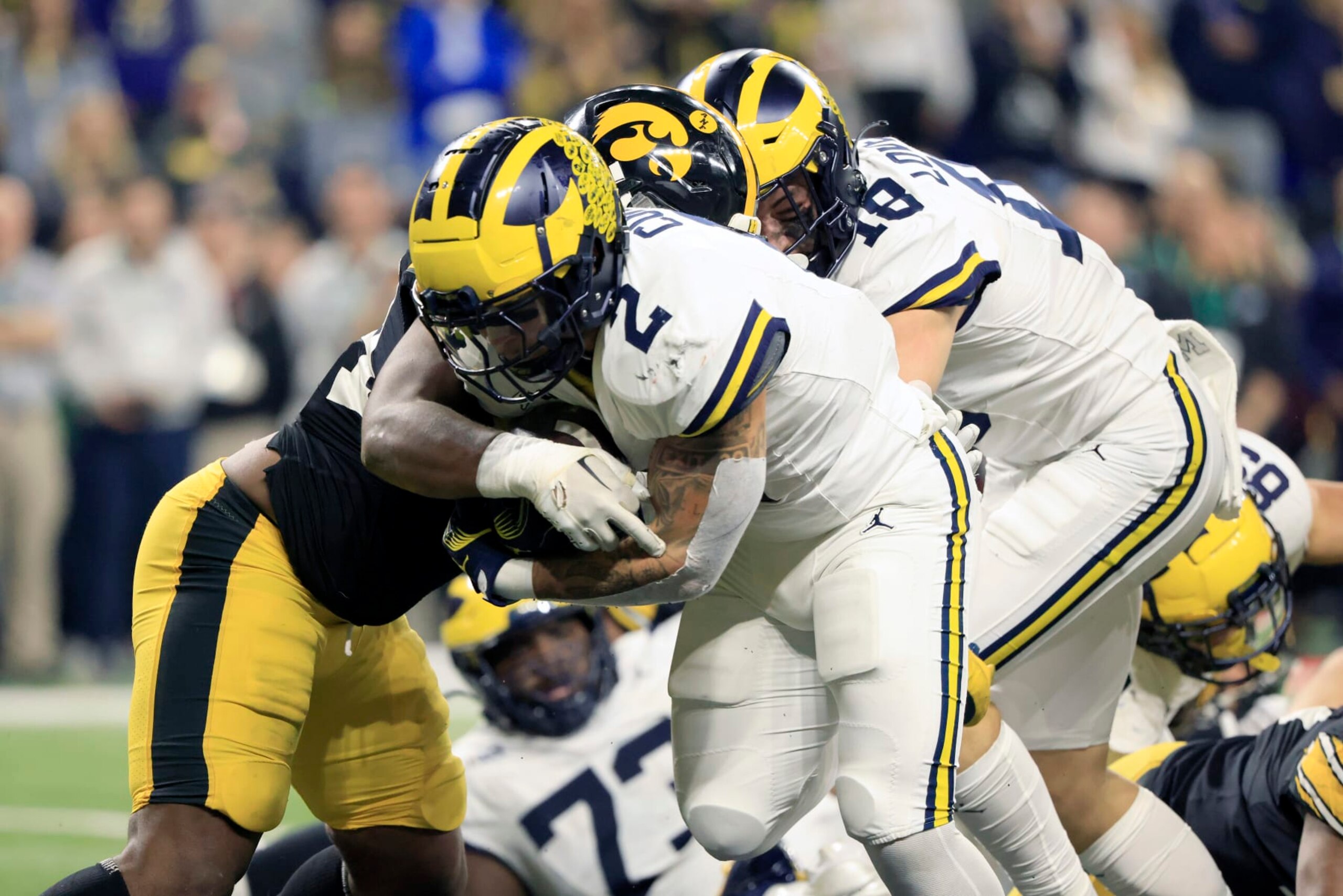INDIANAPOLIS, INDIANA - DECEMBER 02: Blake Corum #2 of the Michigan Wolverines runs the ball for a touchdown in the game against the Iowa Hawkeyes during the first quarter during the Big Ten Championship at Lucas Oil Stadium on December 02, 2023 in Indianapolis, Indiana. (Photo by Justin Casterline/Getty Images)
