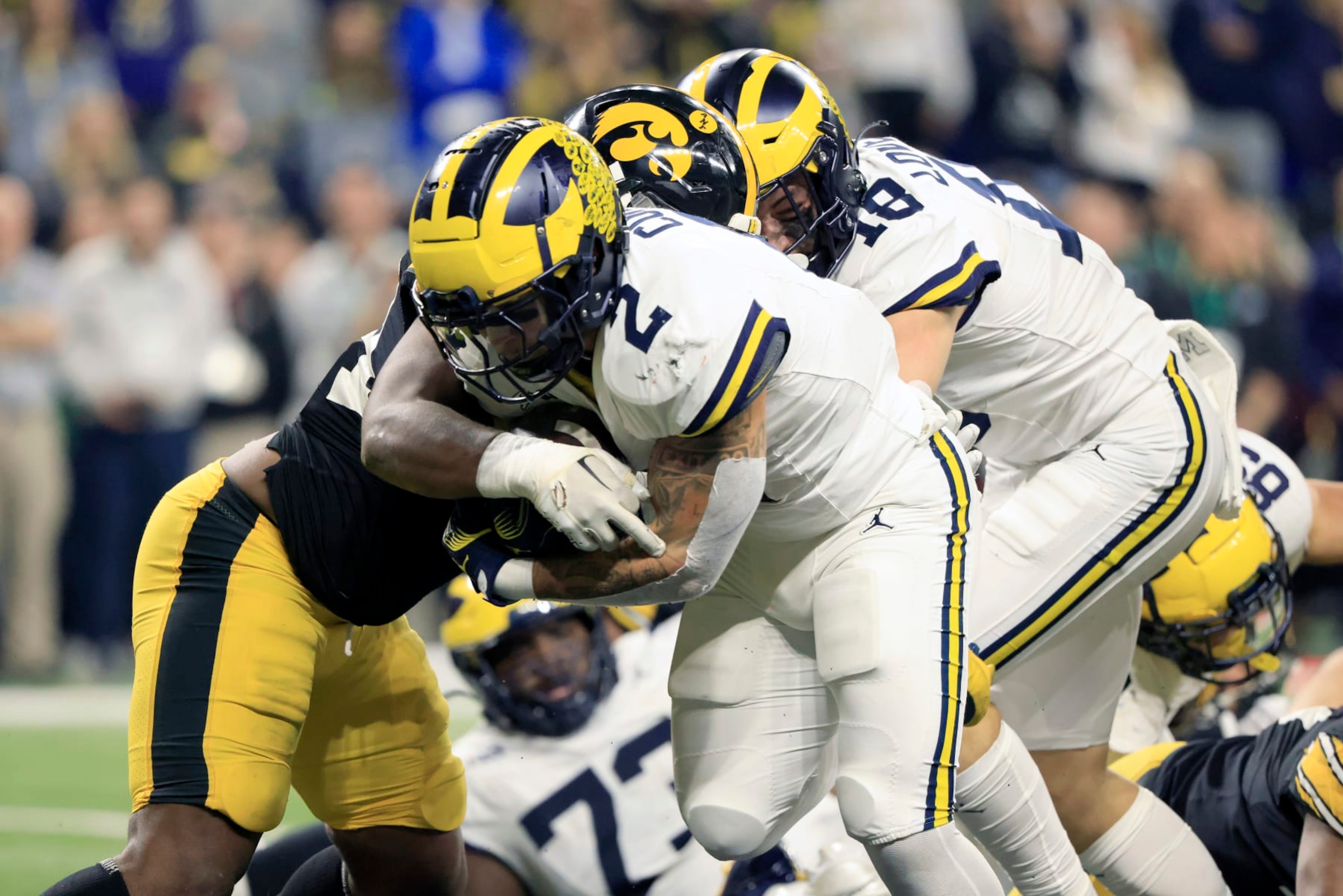 INDIANAPOLIS, INDIANA - DECEMBER 02: Blake Corum #2 of the Michigan Wolverines runs the ball for a touchdown in the game against the Iowa Hawkeyes during the first quarter during the Big Ten Championship at Lucas Oil Stadium on December 02, 2023 in Indianapolis, Indiana. (Photo by Justin Casterline/Getty Images) INDIANAPOLIS, INDIANA - DECEMBER 02: Blake Corum #2 of the Michigan Wolverines runs the ball for a touchdown in the game against the Iowa Hawkeyes during the first quarter during the Big Ten Championship at Lucas Oil Stadium on December 02, 2023 in Indianapolis, Indiana. (Photo by Justin Casterline/Getty Images)