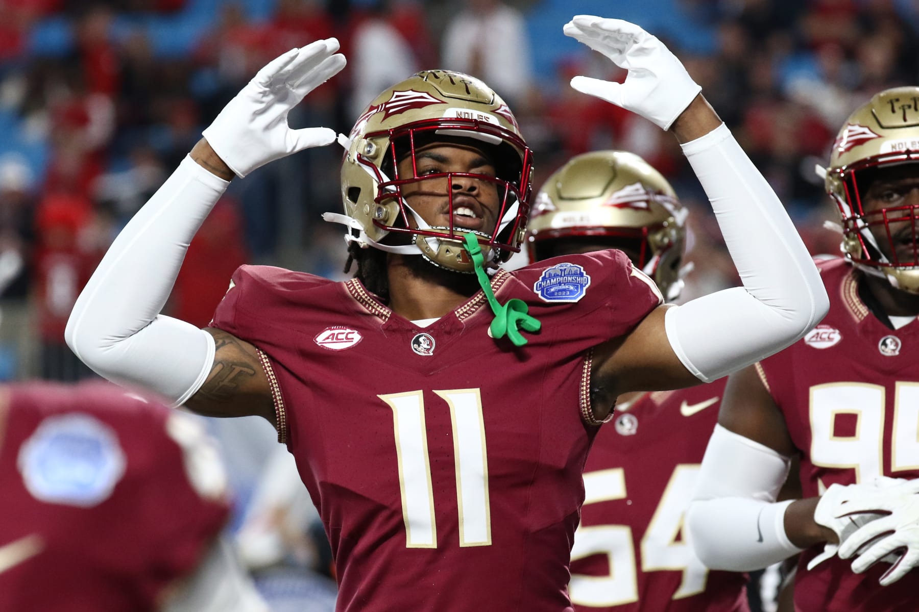 CHARLOTTE, NORTH CAROLINA - DECEMBER 2: Patrick Payton #11 of the Florida State Seminoles cheers on the crowd before taking on the Louisville Cardinals during the ACC Championship at Bank of America Stadium on December 2, 2023 in Charlotte, North Carolina. (Photo by Isaiah Vazquez/Getty Images)