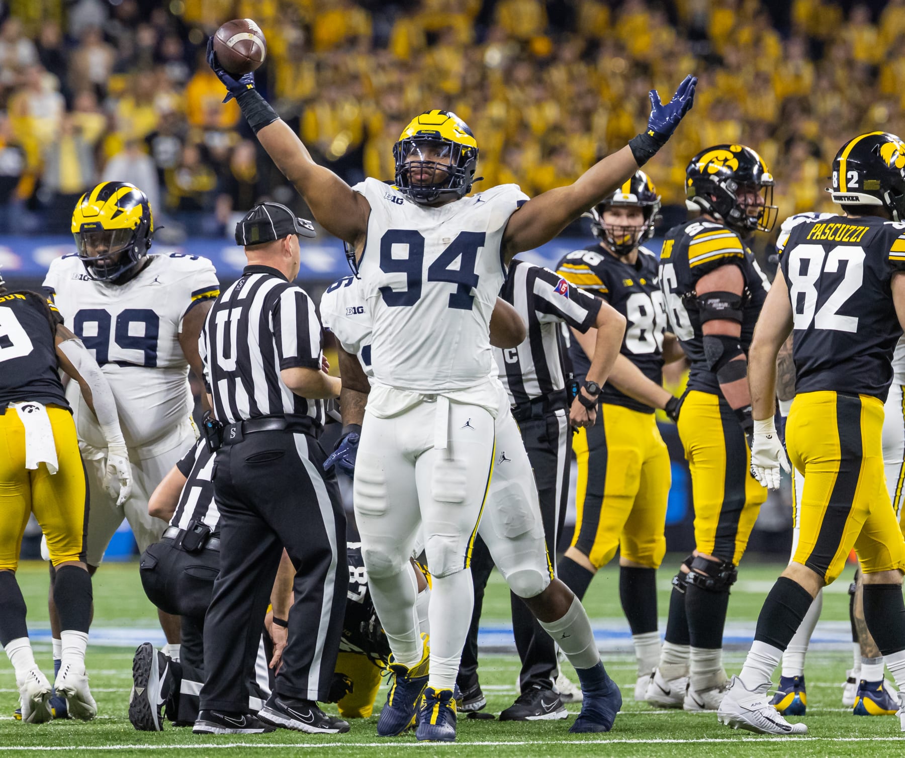 INDIANAPOLIS, INDIANA - DECEMBER 2: Kris Jenkins #94 of the Michigan Wolverines reacts after a fumble recovery against the Iowa Hawkeyes during the first half in the Big Ten Championship at Lucas Oil Stadium on December 2, 2023 in Indianapolis, Indiana. (Photo by Michael Hickey/Getty Images)
