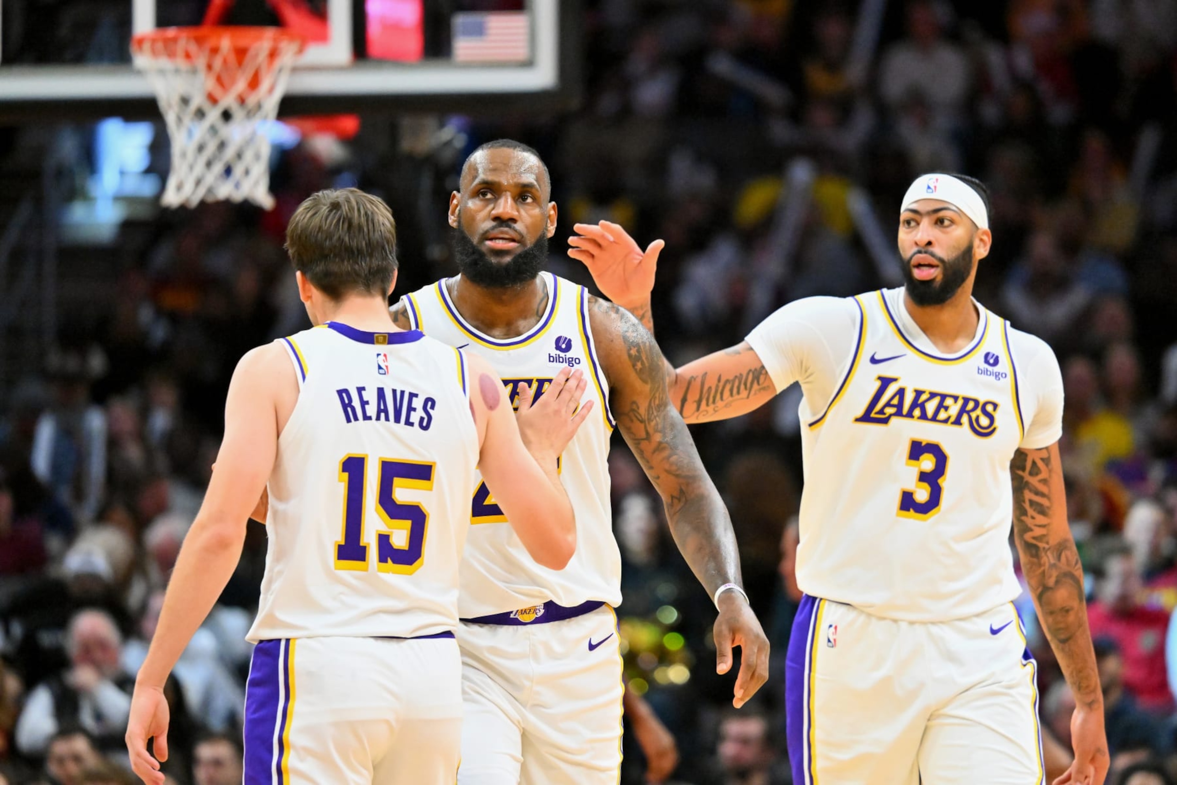 CLEVELAND, OHIO - NOVEMBER 25: Austin Reaves #15 and Anthony Davis #3 celebrate with LeBron James #23 of the Los Angeles Lakers during the third quarter against the Cleveland Cavaliers at Rocket Mortgage Fieldhouse on November 25, 2023 in Cleveland, Ohio. The Lakers defeated the Cavaliers 121-115. NOTE TO USER: User expressly acknowledges and agrees that, by downloading and or using this photograph, User is consenting to the terms and conditions of the Getty Images License Agreement. (Photo by Jason Miller/Getty Images) CLEVELAND, OHIO - NOVEMBER 25: Austin Reaves #15 and Anthony Davis #3 celebrate with LeBron James #23 of the Los Angeles Lakers during the third quarter against the Cleveland Cavaliers at Rocket Mortgage Fieldhouse on November 25, 2023 in Cleveland, Ohio. The Lakers defeated the Cavaliers 121-115. NOTE TO USER: User expressly acknowledges and agrees that, by downloading and or using this photograph, User is consenting to the terms and conditions of the Getty Images License Agreement. (Photo by Jason Miller/Getty Images)