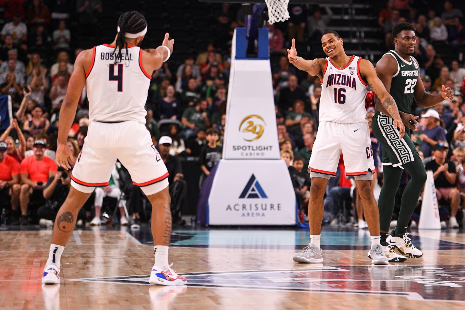 Arizona's Kylan Boswell and Keshad Johnson