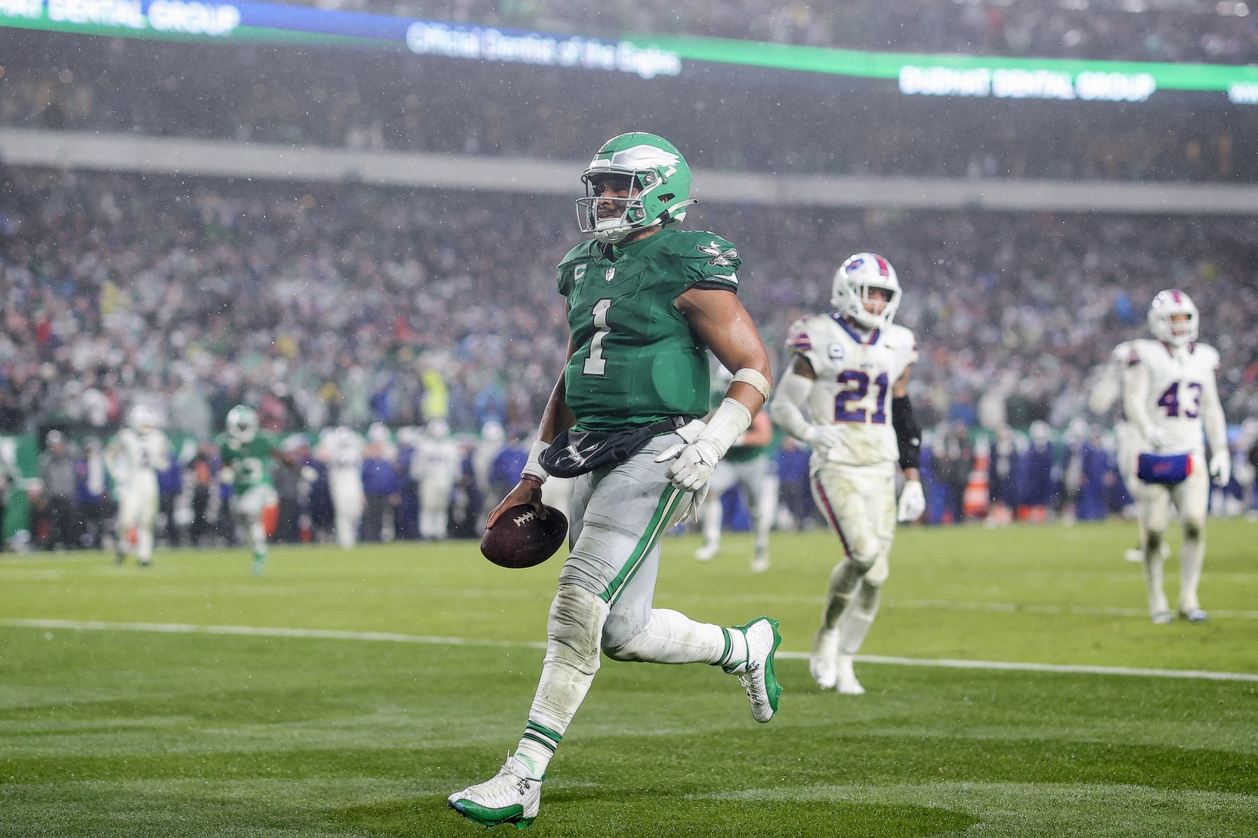 PHILADELPHIA, PENNSYLVANIA - NOVEMBER 26: Jalen Hurts #1 of the Philadelphia Eagles scores the game winning touchdown in overtime against the Buffalo Bills at Lincoln Financial Field on November 26, 2023 in Philadelphia, Pennsylvania. (Photo by Tim Nwachukwu/Getty Images)