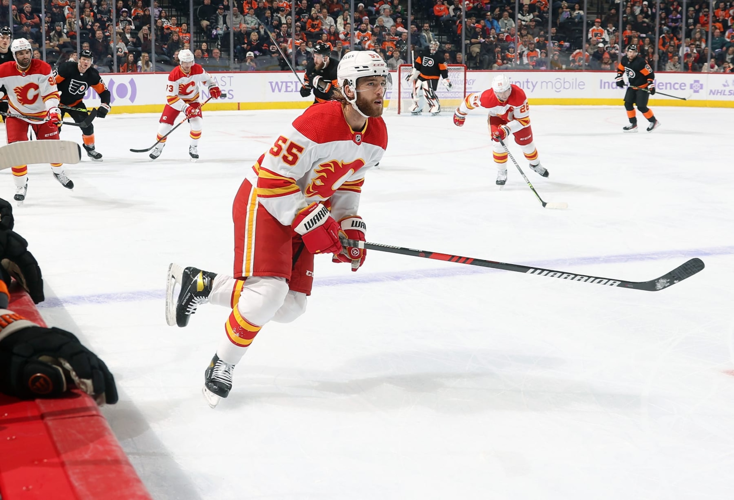 PHILADELPHIA, PENNSYLVANIA - NOVEMBER 21:  Noah Hanifin #55 of the Calgary Flames skates against the Philadelphia Flyers at the Wells Fargo Center on November 21, 2022 in Philadelphia, Pennsylvania.  (Photo by Len Redkoles/NHLI via Getty Images)