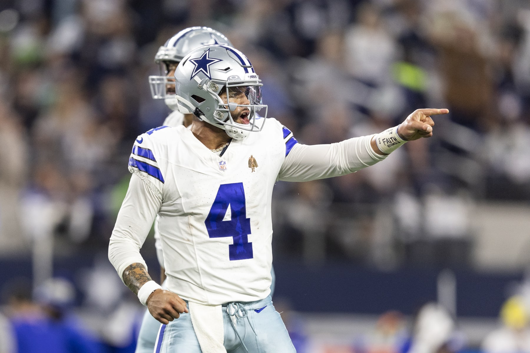 ARLINGTON, TEXAS - NOVEMBER 30: Dak Prescott #4 of the Dallas Cowboys celebrates after a touchdown during an NFL football game between the Dallas Cowboys and the Seattle Seahawks at AT&T Stadium on November 30, 2023 in Arlington, Texas. (Photo by Michael Owens/Getty Images)