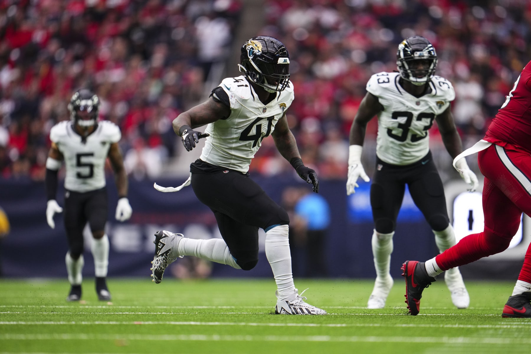 HOUSTON, TX - NOVEMBER 26: Josh Allen #41 of the Jacksonville Jaguars rushes the passer during an NFL football game against the Houston Texans at NRG Stadium on November 26, 2023 in Houston, Texas. (Photo by Cooper Neill/Getty Images)
