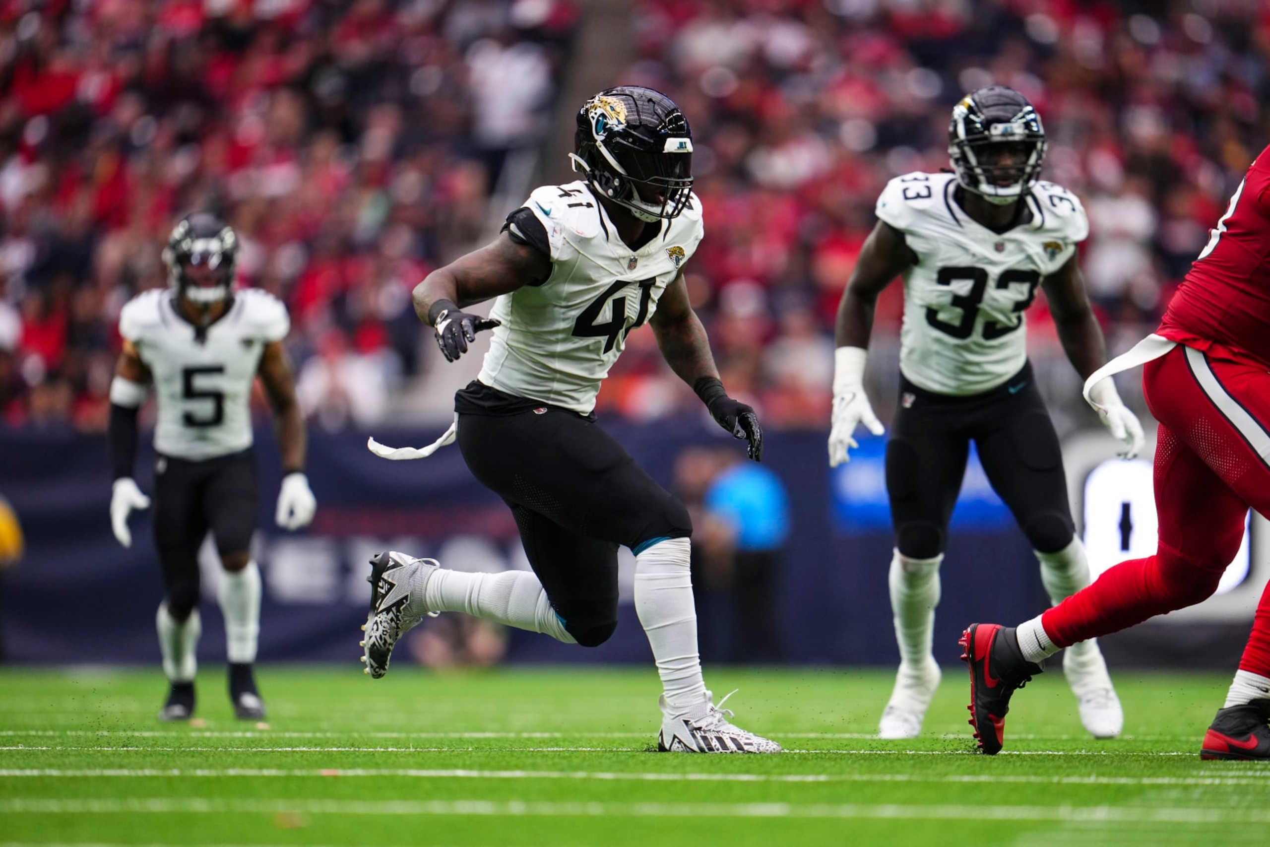 HOUSTON, TX - NOVEMBER 26: Josh Allen #41 of the Jacksonville Jaguars rushes the passer during an NFL football game against the Houston Texans at NRG Stadium on November 26, 2023 in Houston, Texas. (Photo by Cooper Neill/Getty Images)