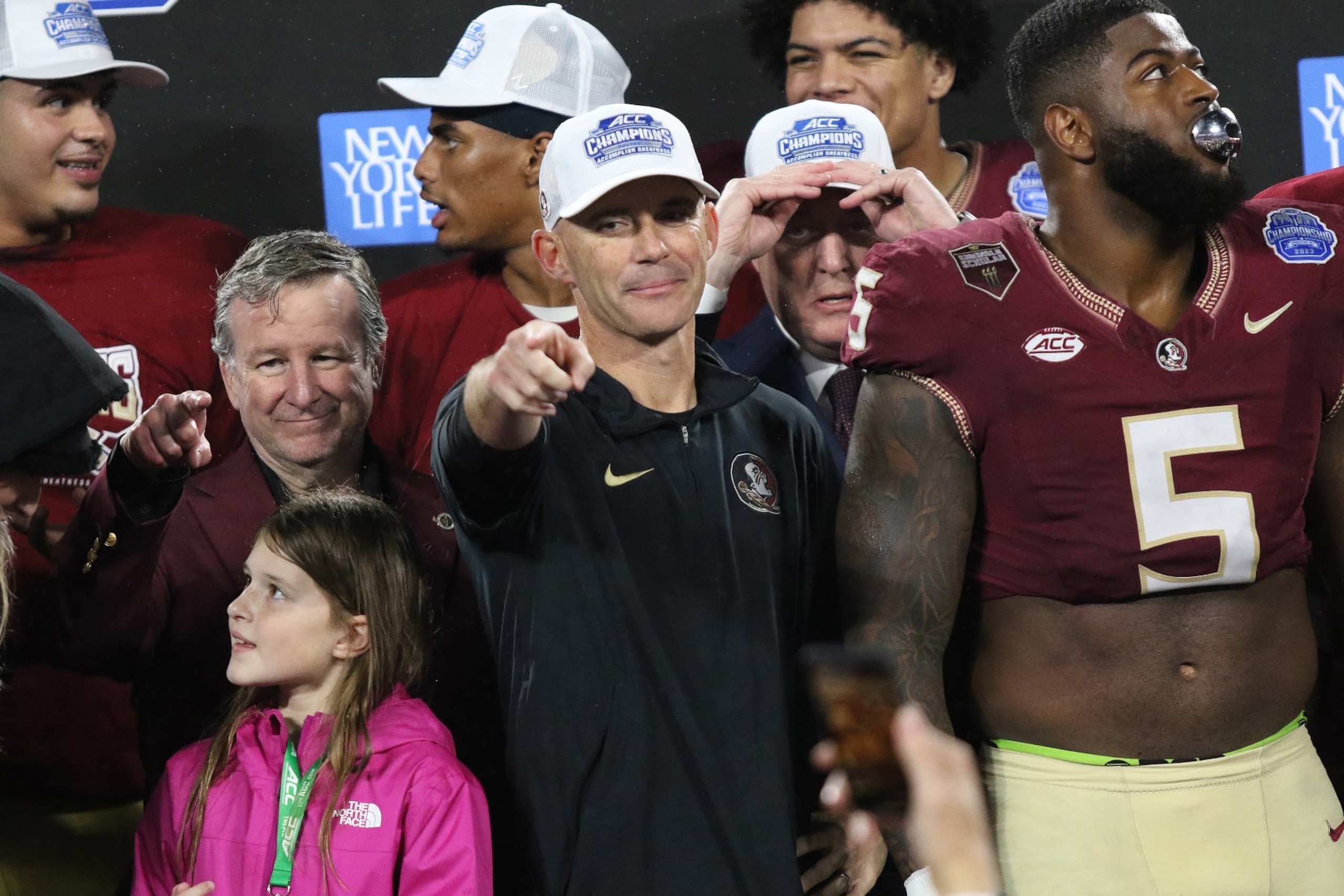 CHARLOTTE, NC - DECEMBER 02: Florida State Seminoles head coach Mike Norvell points to a friend during the awards presentation during the ACC Football Championship Game between the Louisville Cardinals and the Florida State Seminoles on December 2, 2023 at Bank of America Stadium in Charlotte, N.C. (Photo by John Byrum/Icon Sportswire via Getty Images)